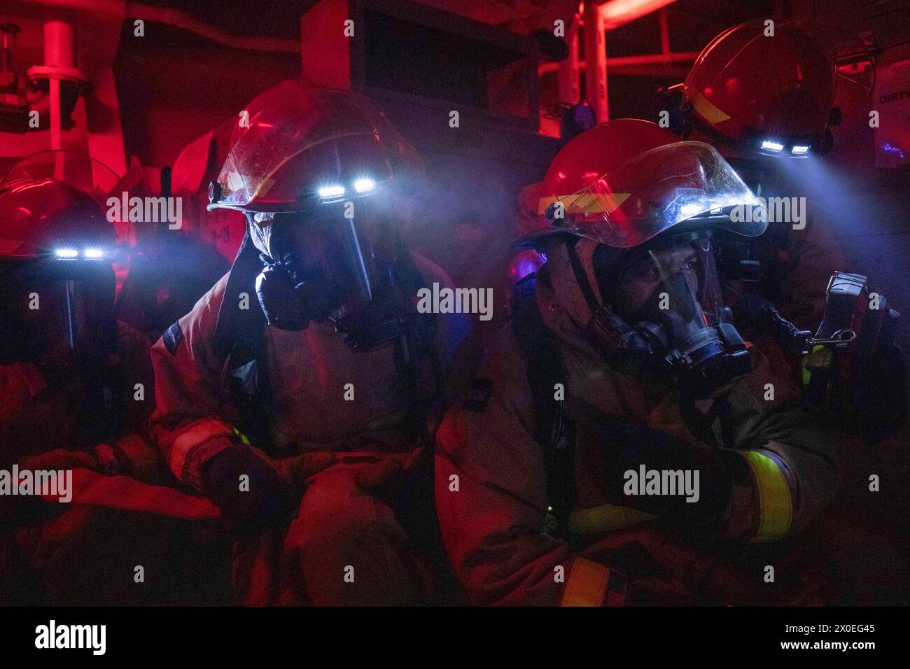 South China Sea. 27th Mar, 2024. U.S. Sailors conduct firefighting training during a general quarters drill aboard the Arleigh Burke-class guided-missile destroyer USS Russell (DDG 59), March 27, 2024. Russell, part of Carrier Strike Group Nine, is underway conducting routine operations in the U.S. 7th Fleet area of operations. U.S. 7th Fleet is the U.S. Navys largest forward-deployed numbered fleet, and routinely interacts and operates with allies and partners in preserving a free and open Indo-Pacific region. (Credit Image: © U.S. Navy/ZUMA Press Wire) EDITORIAL USAGE ONLY! Not for Commerc Stock Photo