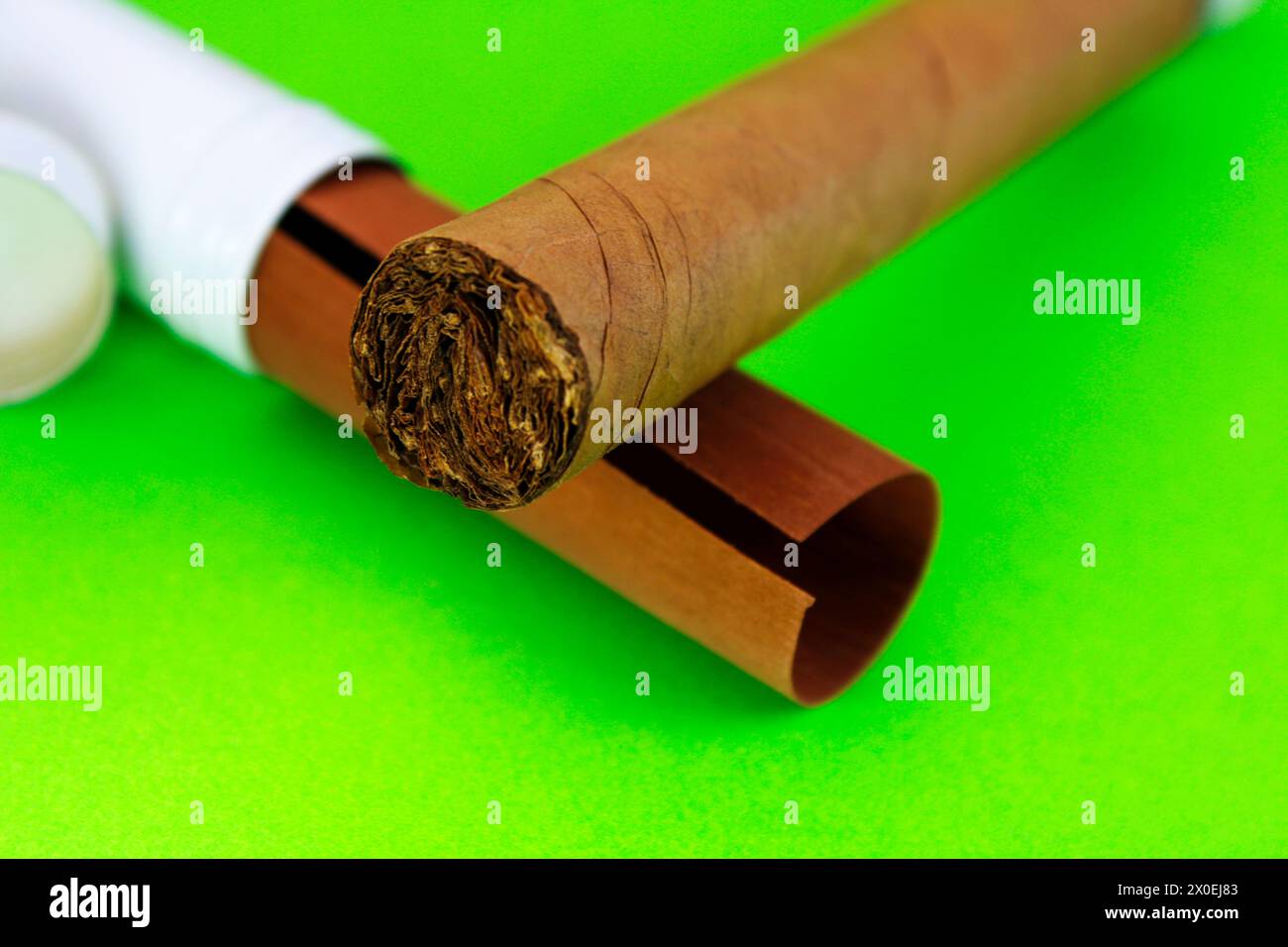 Tobacco out of its container on cedar sheet Stock Photo