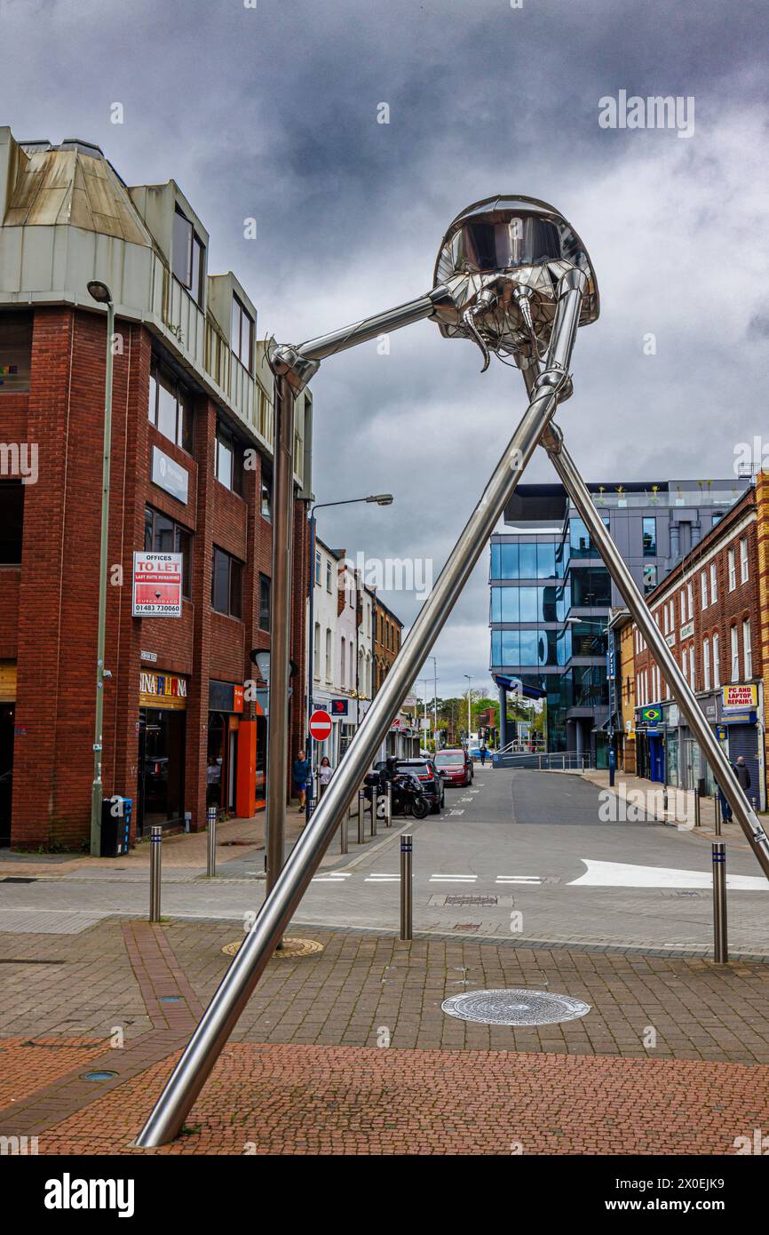 The Martian statue in the town centre of Woking, a town in Surrey, England, from the H G Wells novel 'War of the Worlds' set in nearby Horsell Common Stock Photo