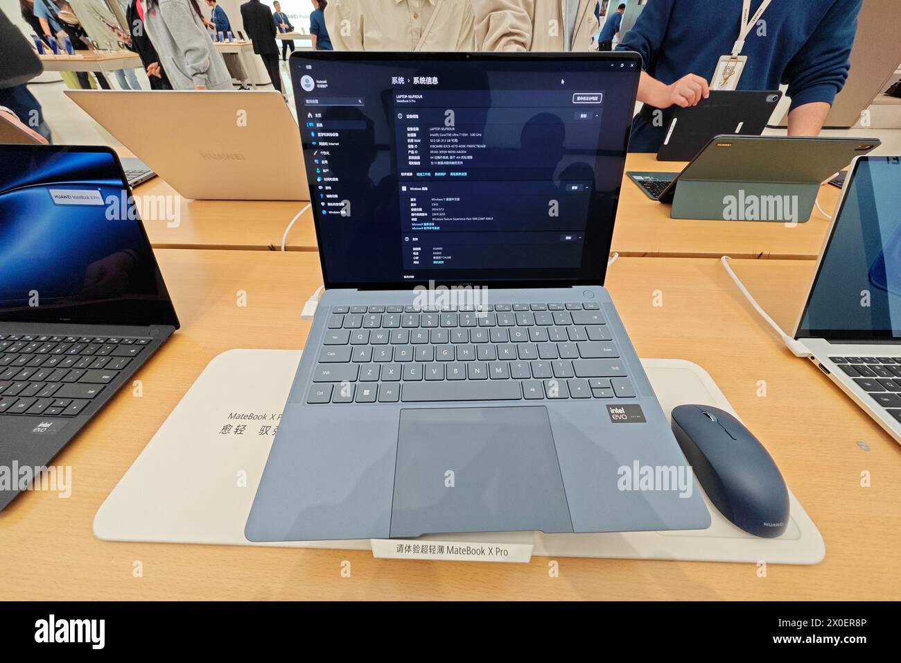 SHANGHAI, CHINA - APRIL  11, 2024 - Customers experience the MateBook X Pro, a newly released laptop from Huawei, at the Huawei flagship store on Nanj Stock Photo