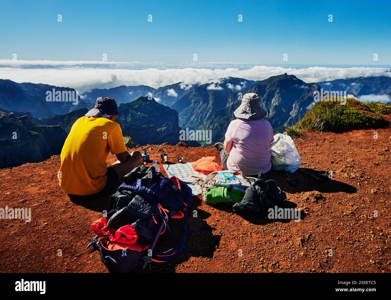 Hikers enjoying the view from the top of PR1 trail,  Pico do Arierio To Pico Ruivo Hike, On Madeira Island, Portugal, Europe Stock Photo