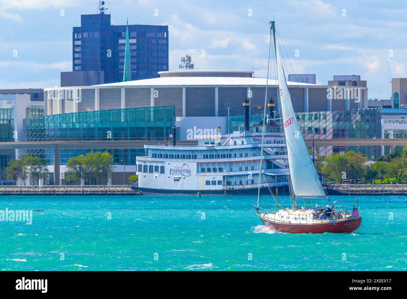 Sailing on the Detroit River in Detroit, Michigan, USA, with the Detroit International Riverfront in the background. Stock Photo