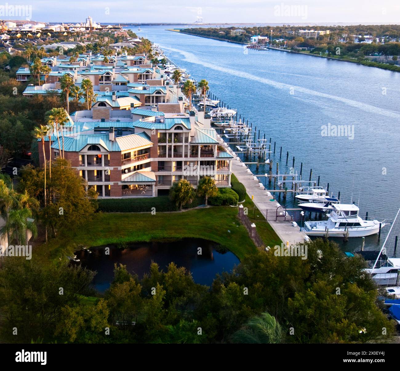 boats docked by walkway to cruise ship port along Hillsborough River - Tampa, Florida, USA Stock Photo