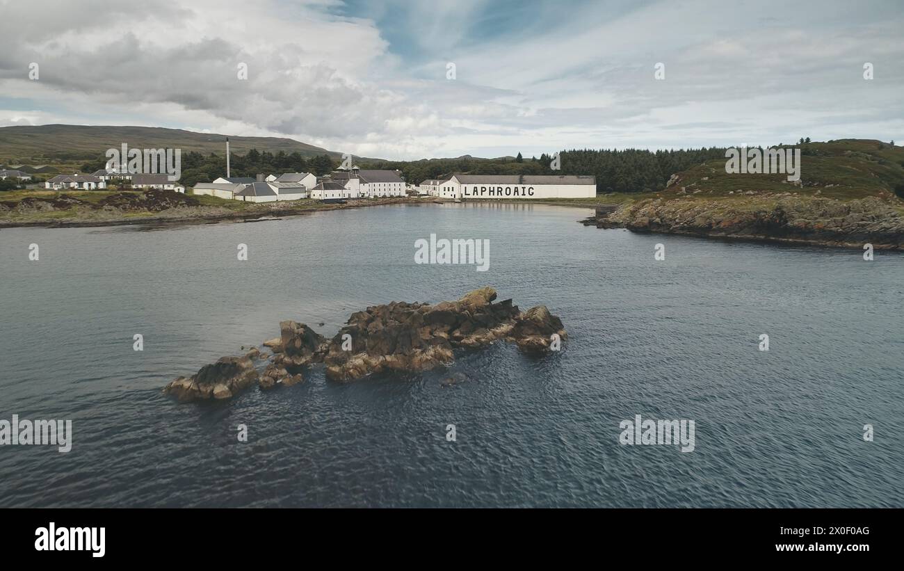 2018.08.07 Laphroaig distillery, Port town Ellen, Islay Island, United Kingdom, Europe. Whiskey production. Alcohol industrial factory at seascape. Alcoholic industry building, warehouse at sea bay Stock Photo