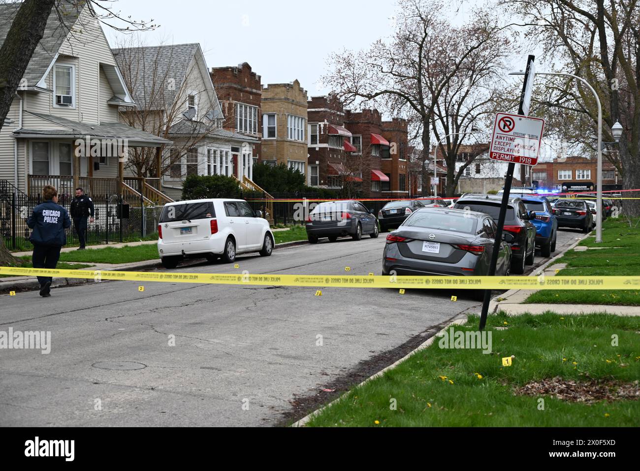 Shell casings discovered at the crime scene and marked by several ...