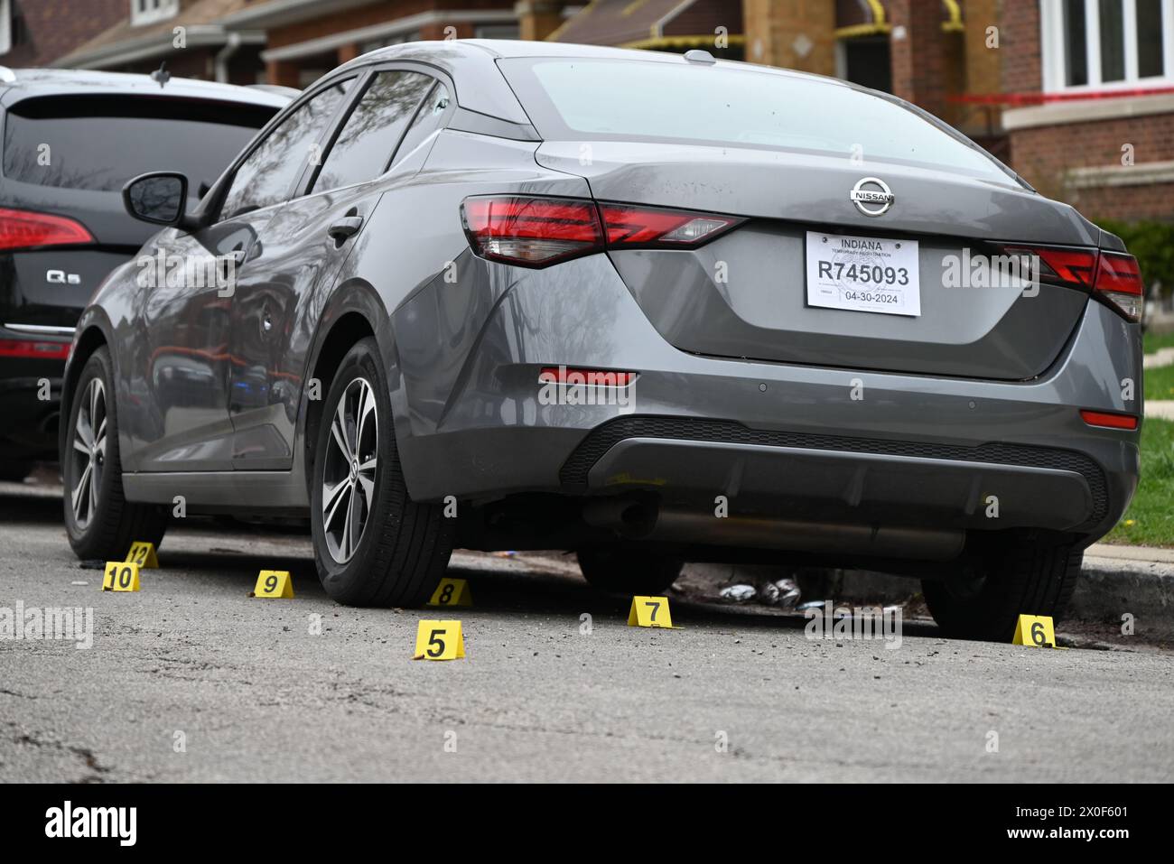 Shell casings discovered at the crime scene and marked by several ...