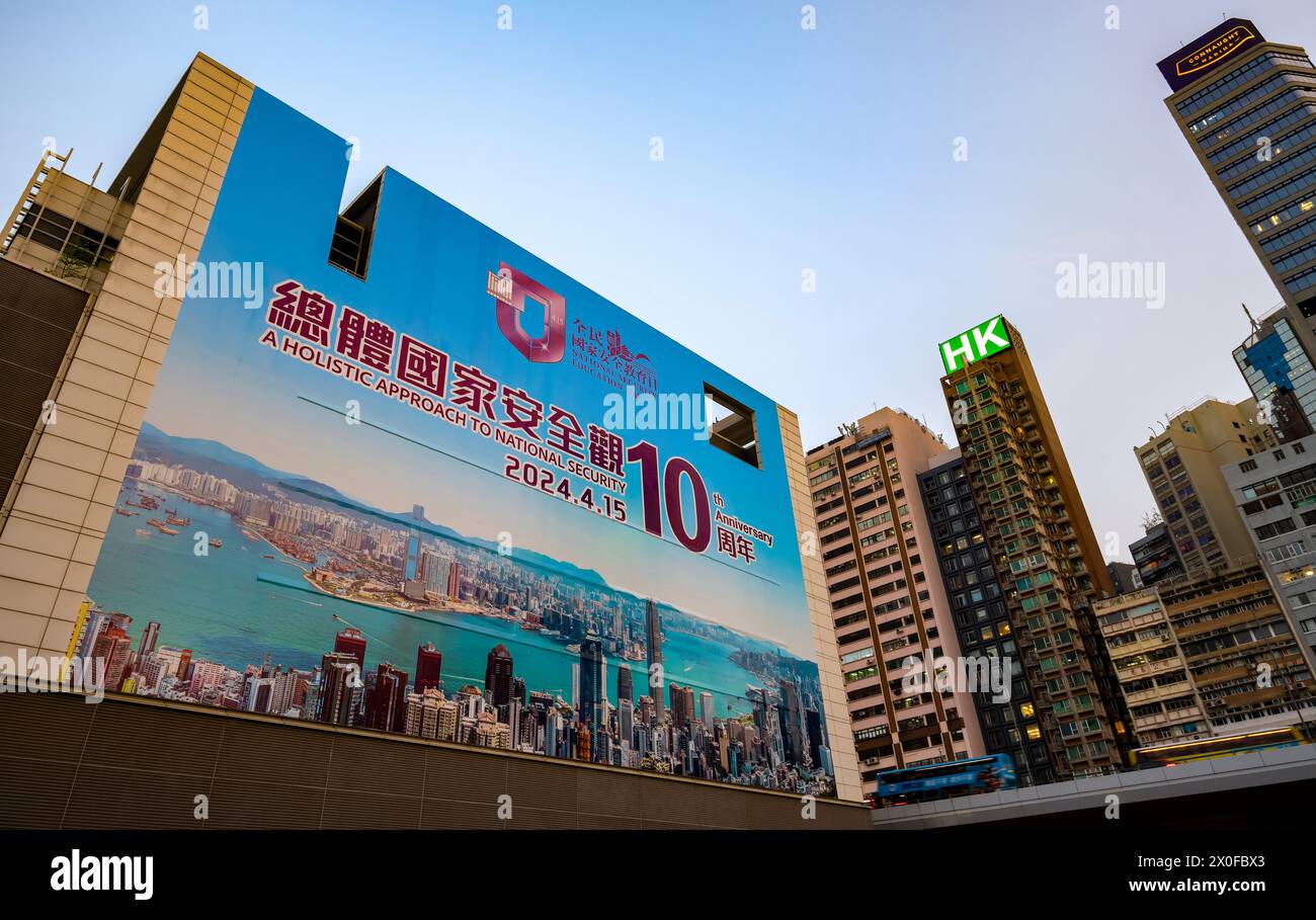 A banner covering the side of a large building in the city center