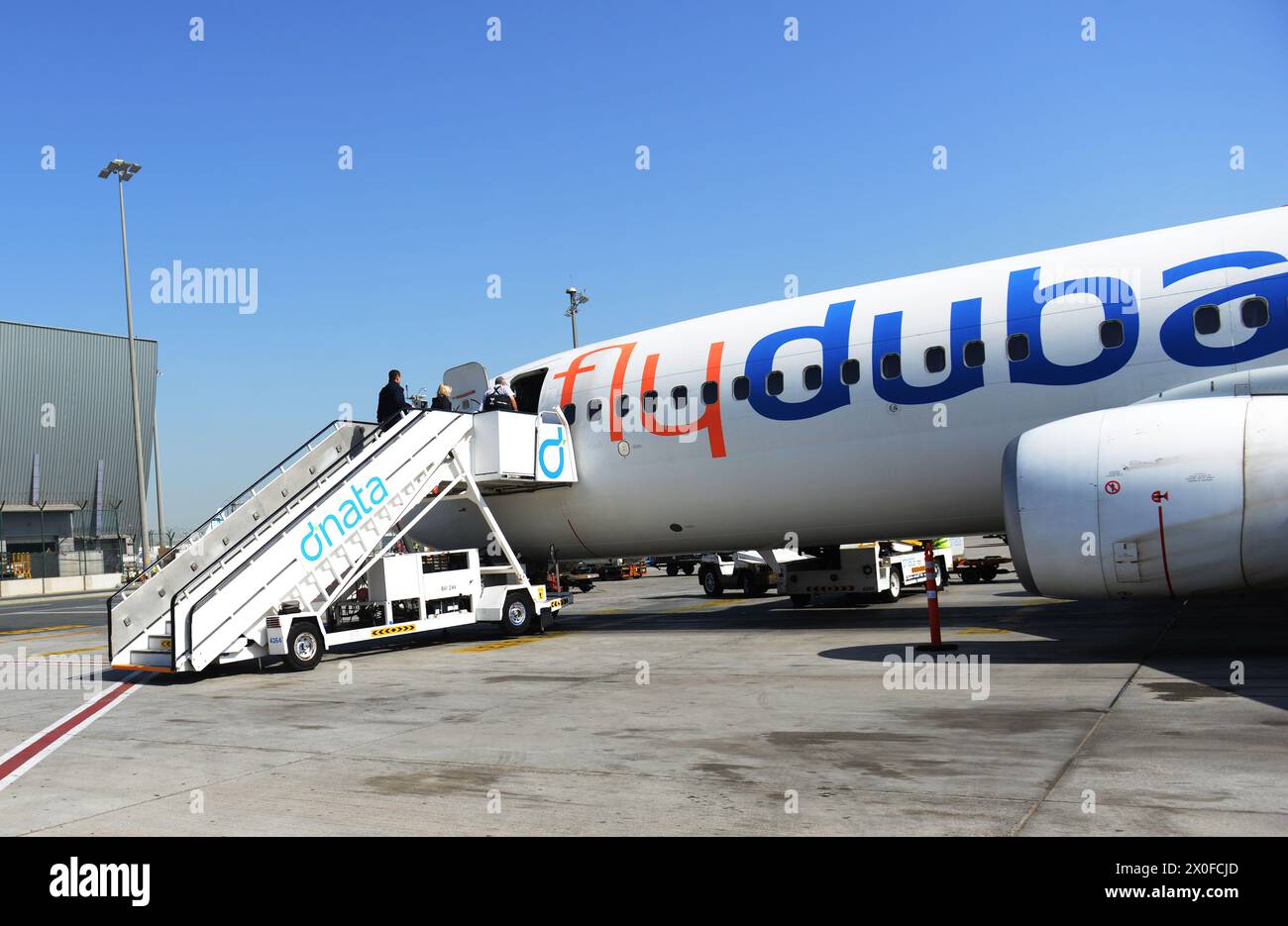 A Fly Dubai airplane at the International airport in Dubai, UAE Stock ...