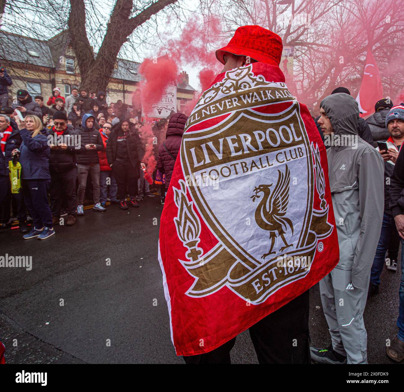 Liverpool FC supporters wearing flag before the kick-of at Anfield Stock Photo