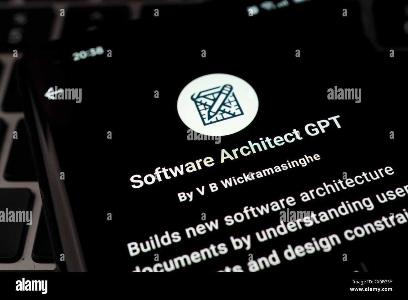 SOFTWARE ARCHITECT custom GPT seen in GPT Store on the screen of smartphone placed on laptop keyboad. Stafford, United Kingdom, April 8, 2024 Stock Photo