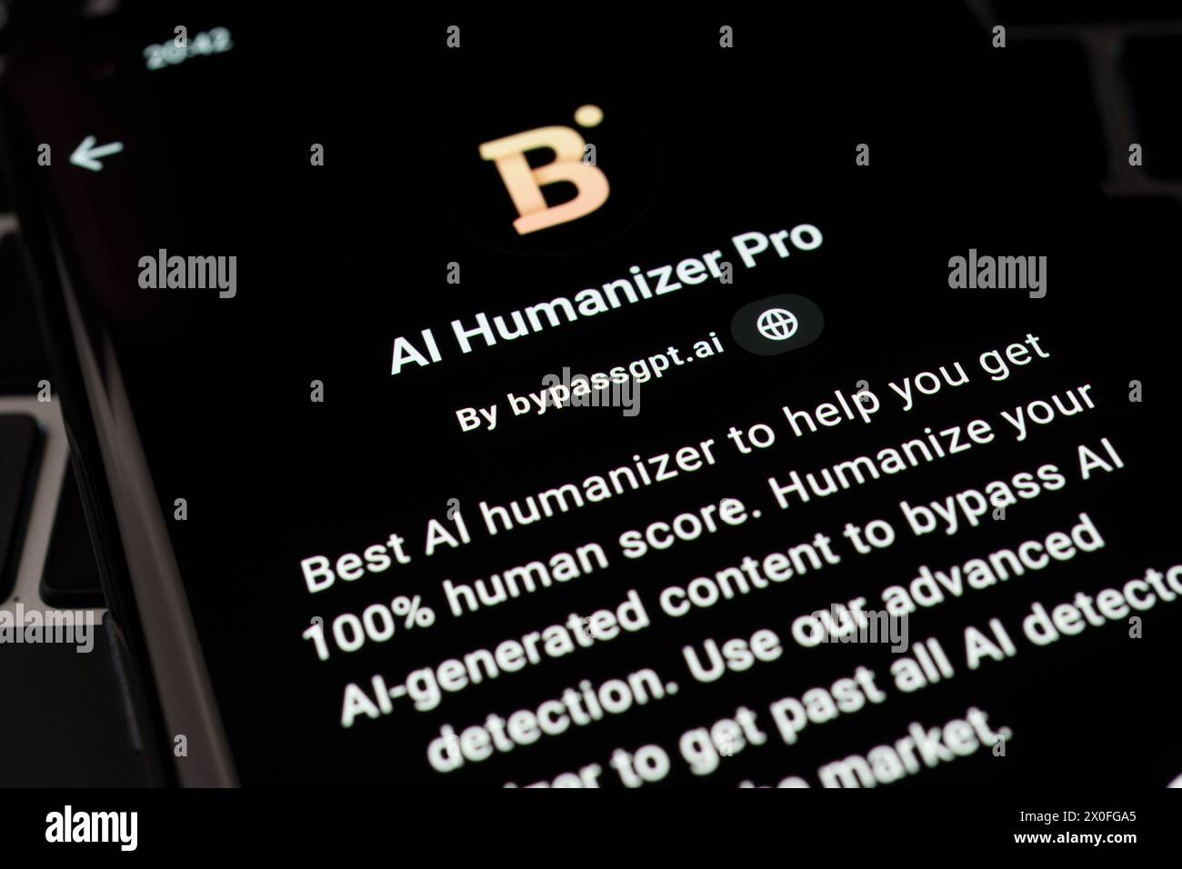 AI HUMANIZER PRO custom GPT seen in GPT Store on the screen of smartphone placed on laptop keyboad. Stafford, United Kingdom, April 8, 2024 Stock Photo