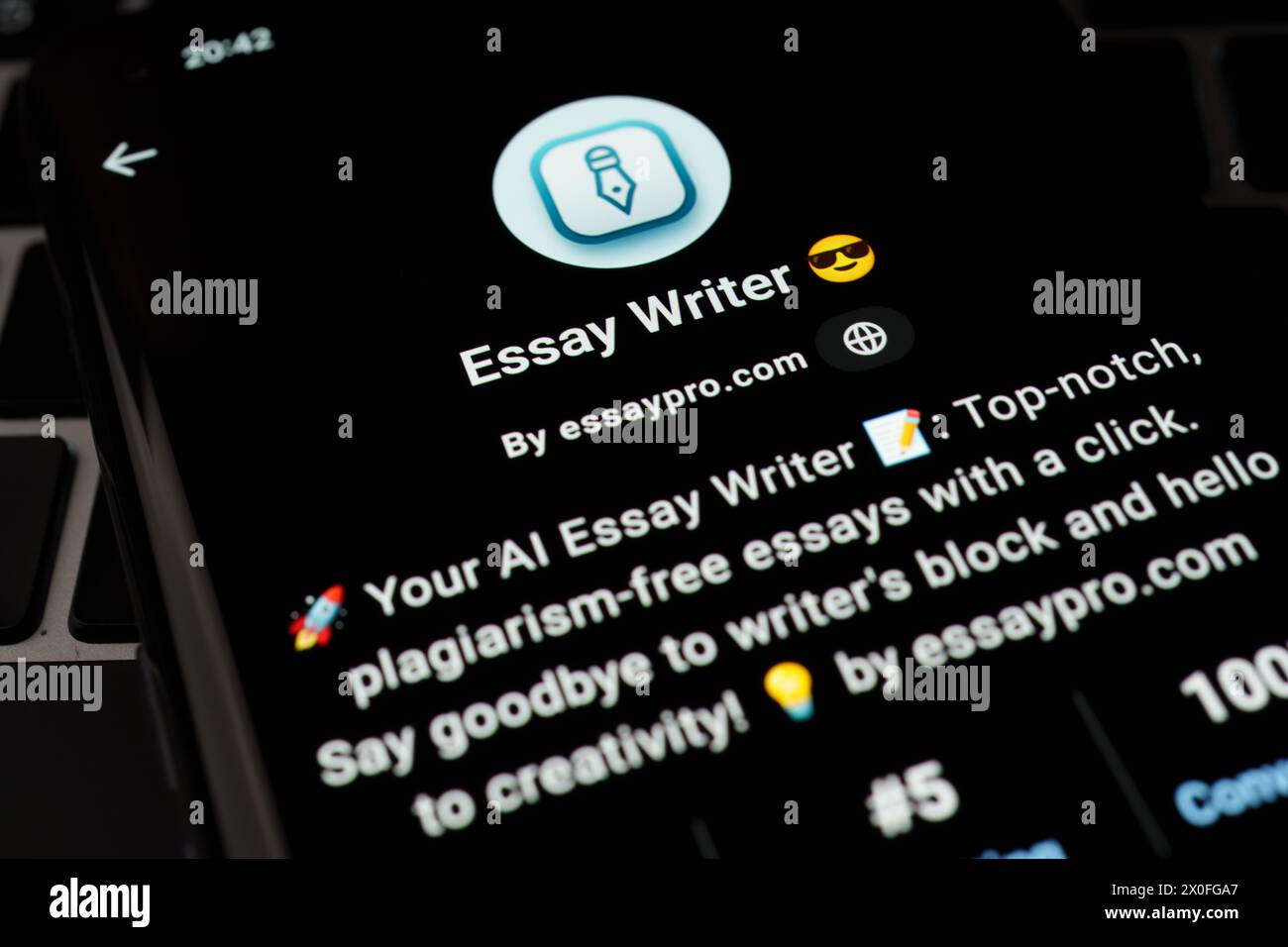 ESSAY WRITER custom GPT seen in GPT Store on the screen of smartphone placed on laptop keyboad. Stafford, United Kingdom, April 8, 2024 Stock Photo