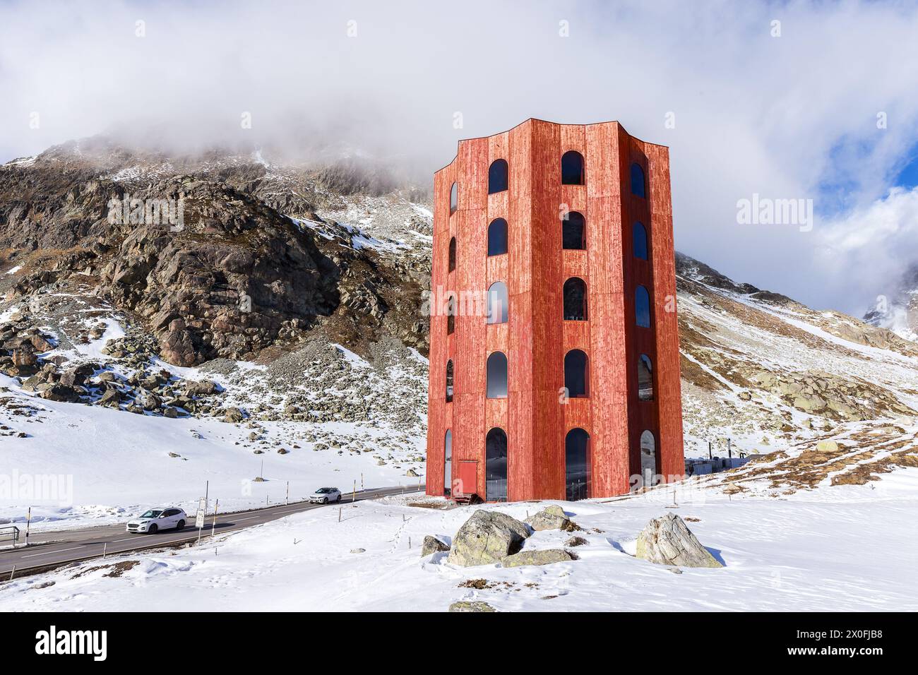 Grisons, Switzerland - March 12. 2023:The red Julier Theater Tower on the Julier Pass (2284 m above sea level) in winter. Canton of Graubuenden, Switz Stock Photo