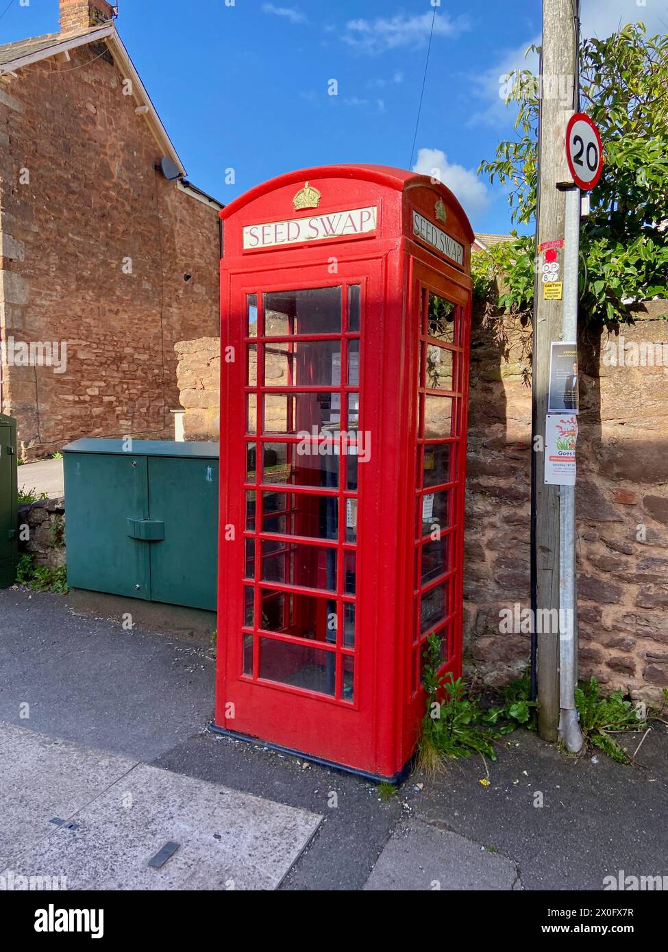 a classic K2 british red telephone kiosk being reused as a seed swap in bishops lydeard near taunton somerset england UK Stock Photo