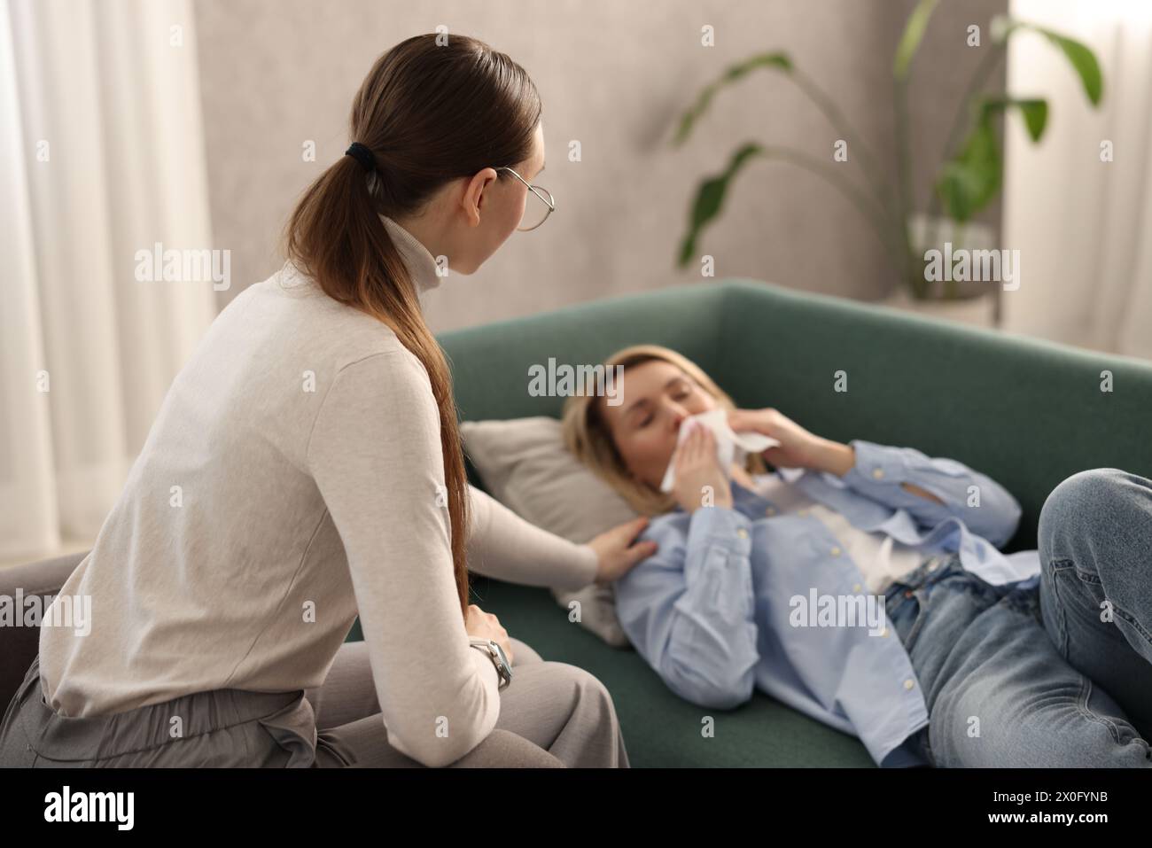 Professional psychotherapist working with patient in office Stock Photo