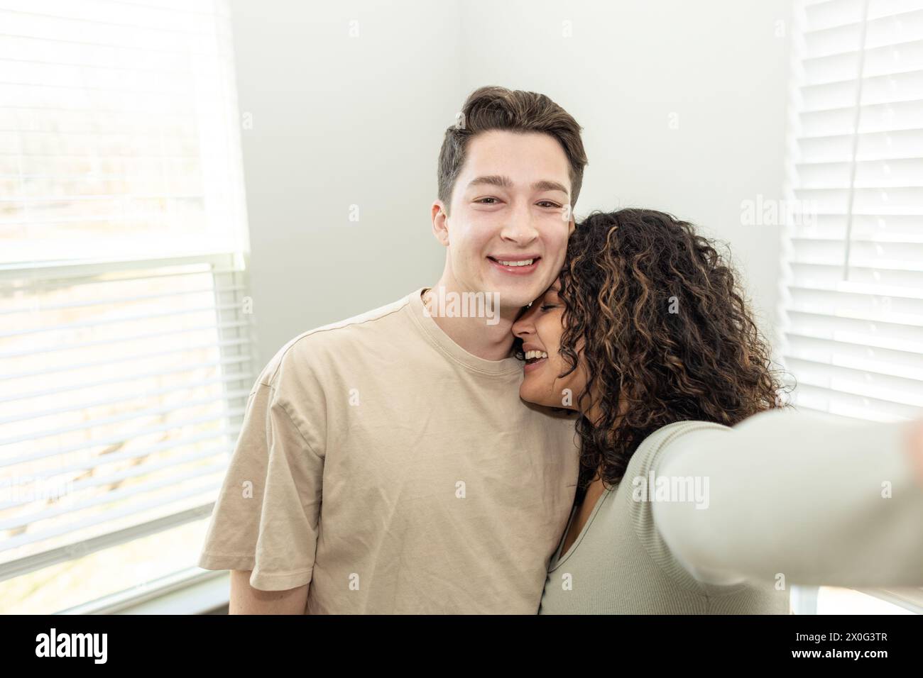 Couple taking a selfie in their home Stock Photo