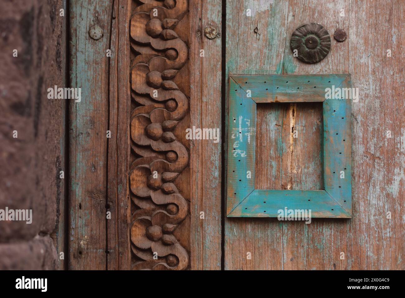 Detailed of old rustic engraved wooden door Stock Photo