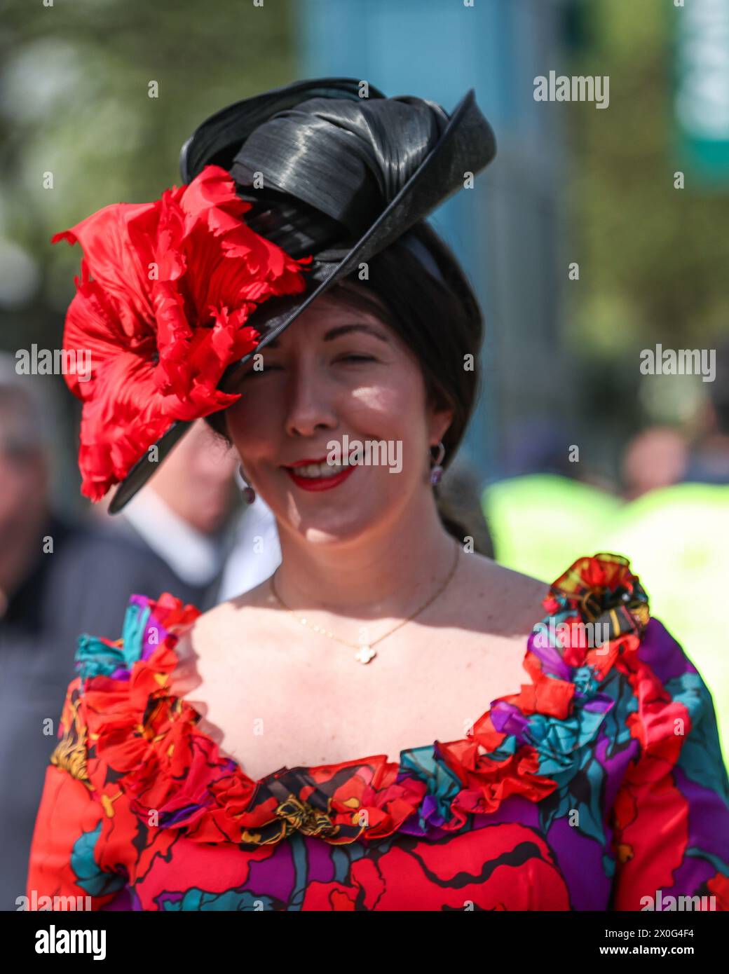 Racegoers arrive on ladies day at during the The Randox Grand National
