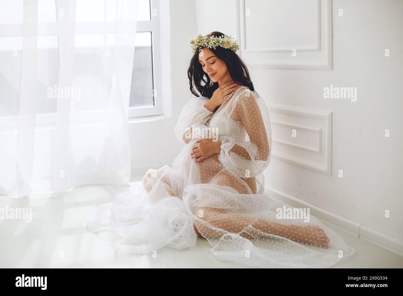 Pregnant woman in negligee hi-res stock photography and images - Alamy