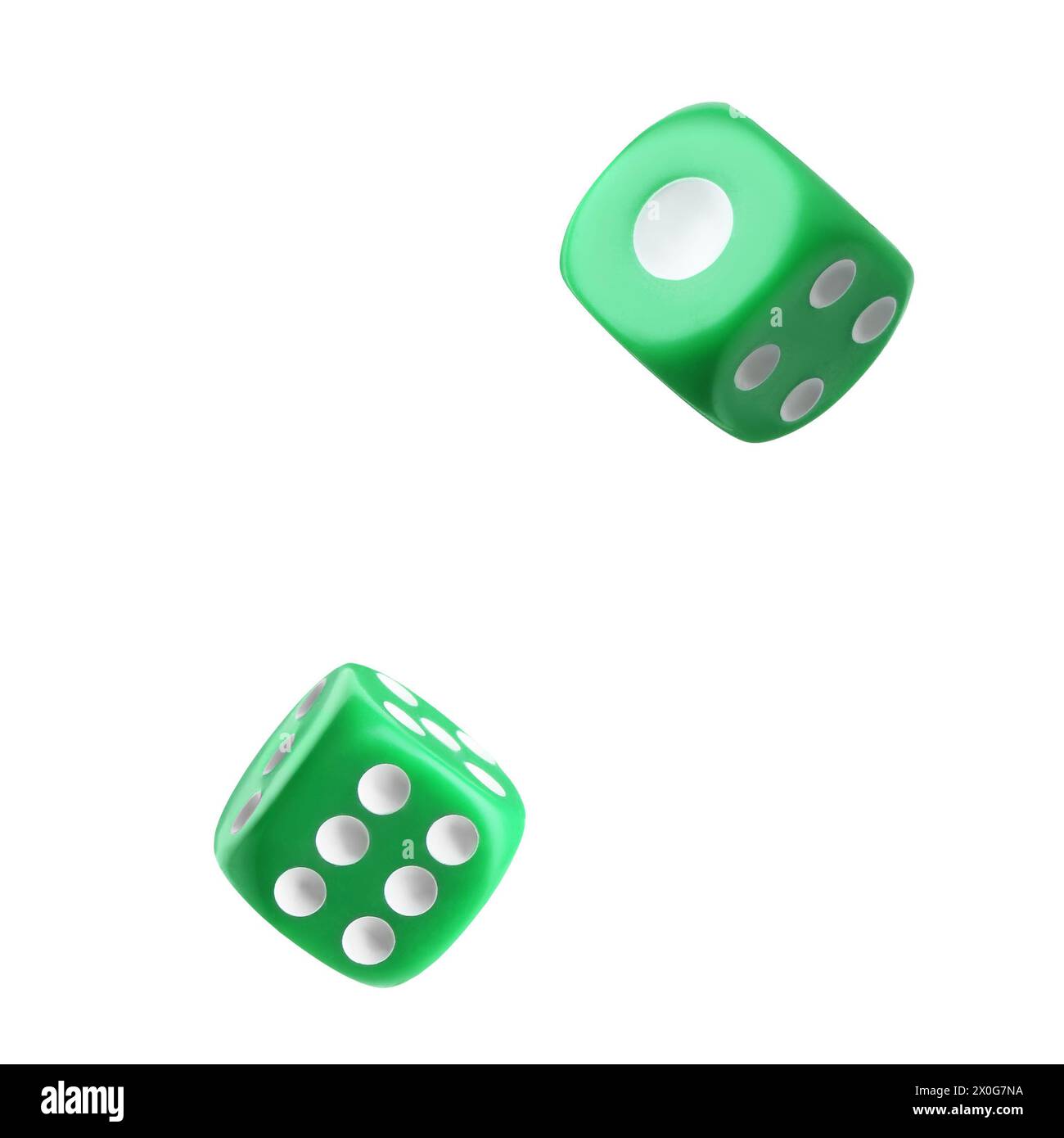 Two green dice in air on white background Stock Photo