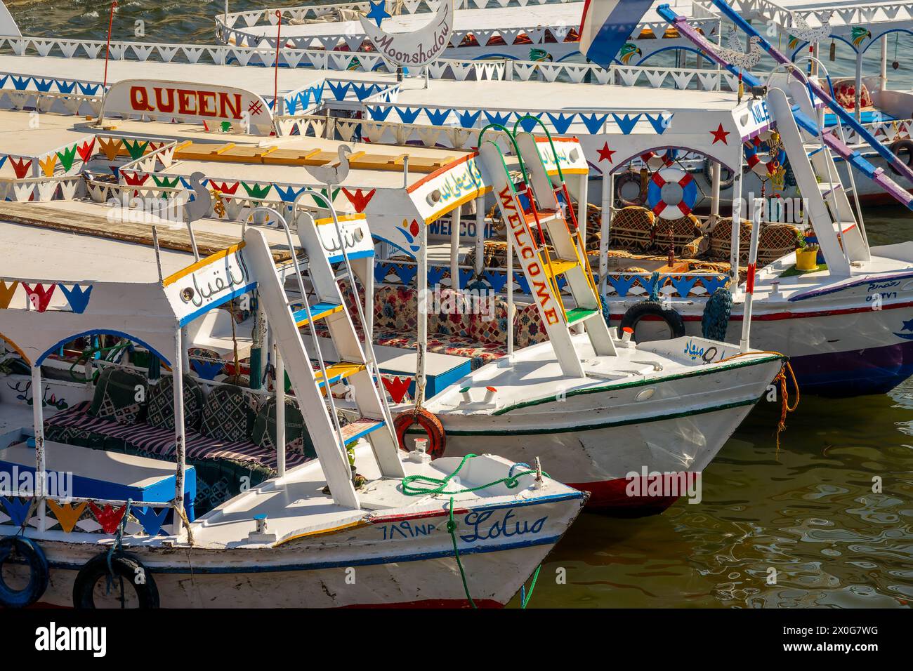 Close up of traditional coloful motorboats ferries on the Nile river, Luxor, Egypt Stock Photo