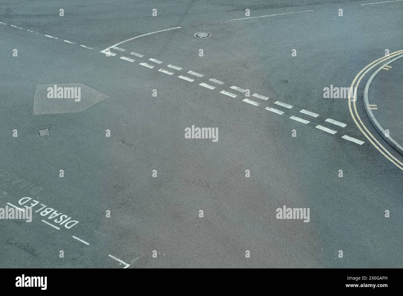 Road markings and pavement with kerb white lines and yellow lines Stock