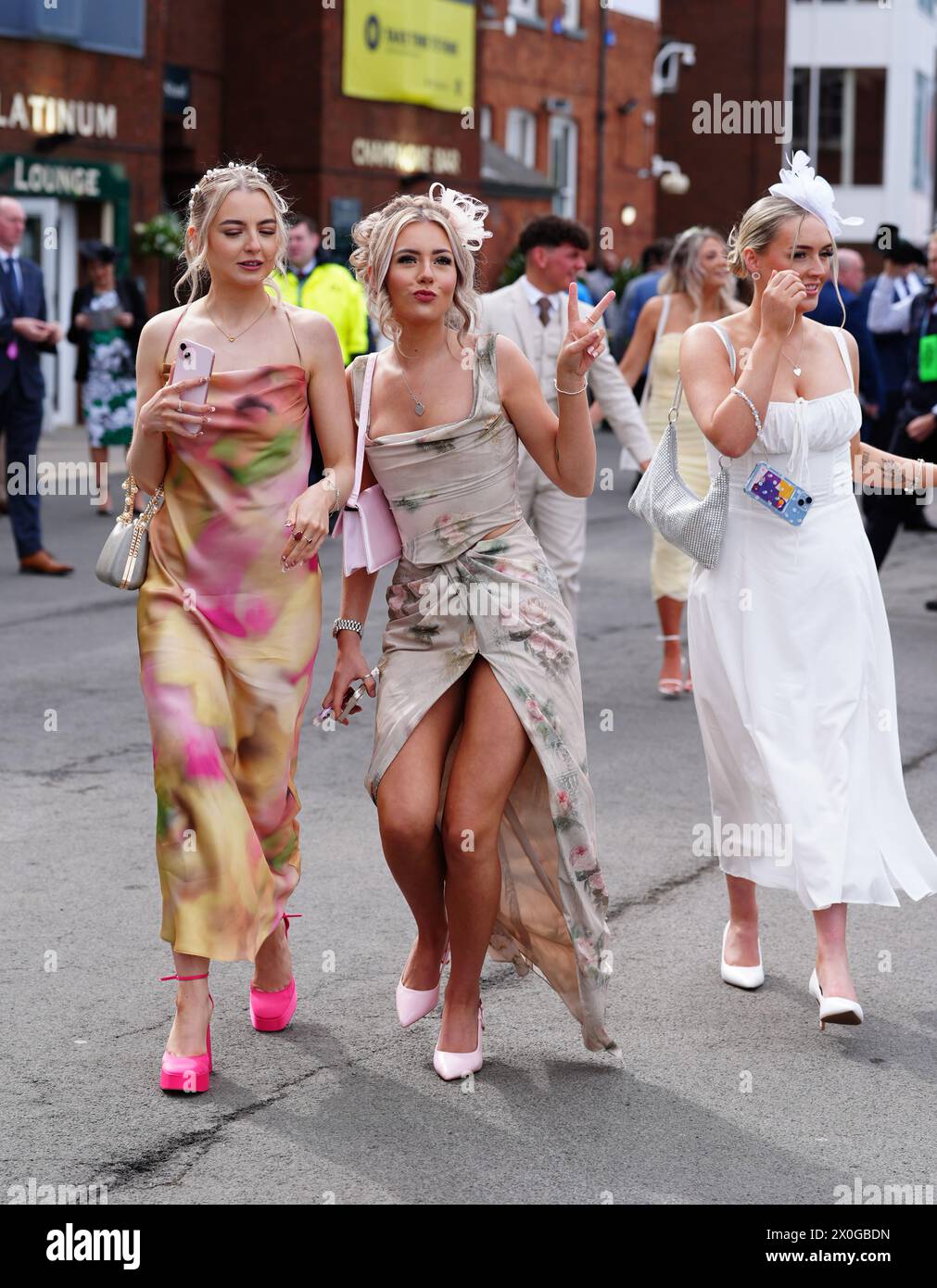Racegoers on day two of the 2024 Randox Grand National Festival at Aintree Racecourse, Liverpool. Picture date: Friday April 12, 2024. Stock Photo