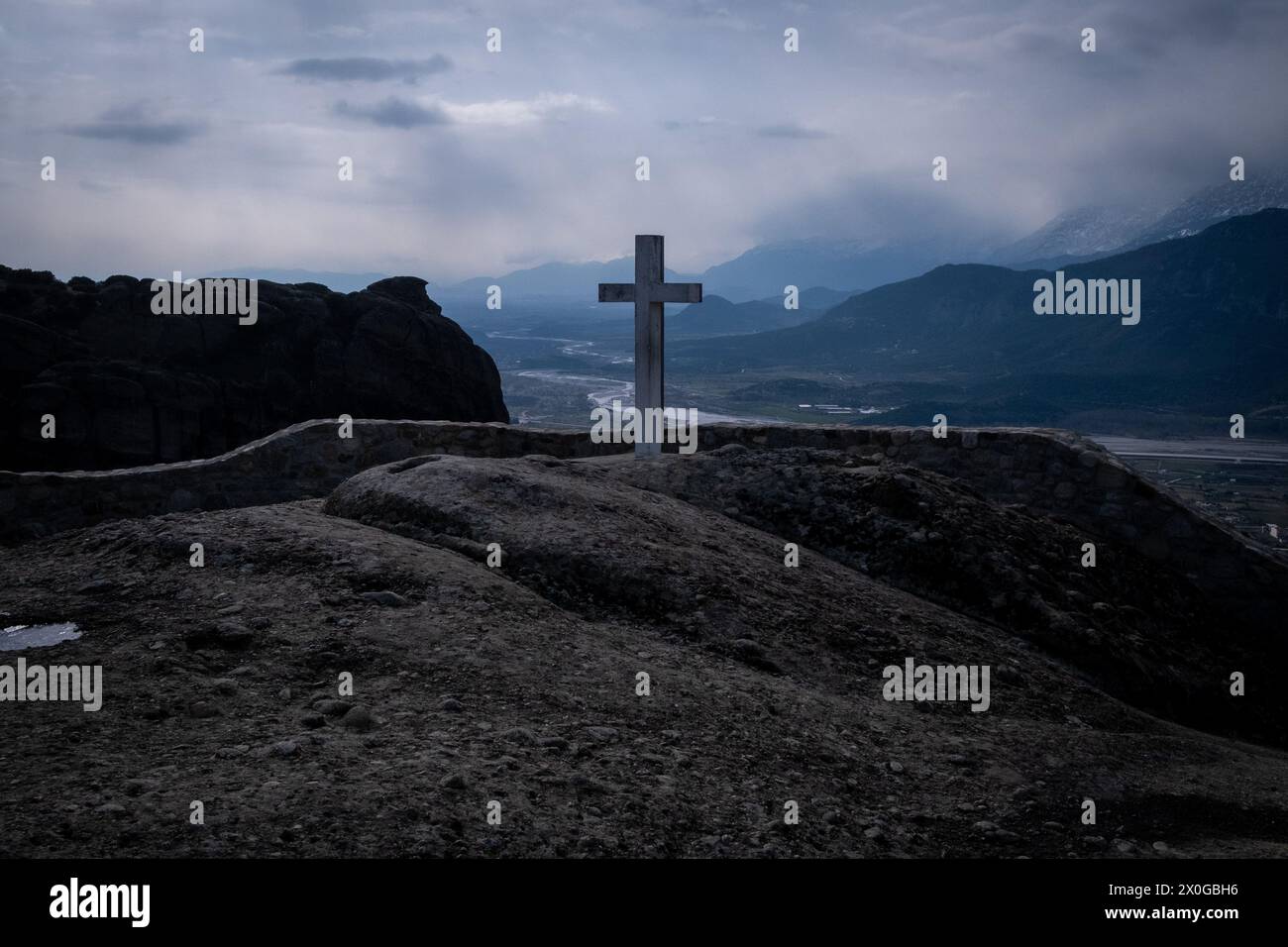 Cross on the terrace of Aghia Triada Monastery Meteora region, a geological formation in northern Greece, in the regional district of Trikala, Thessal Stock Photo