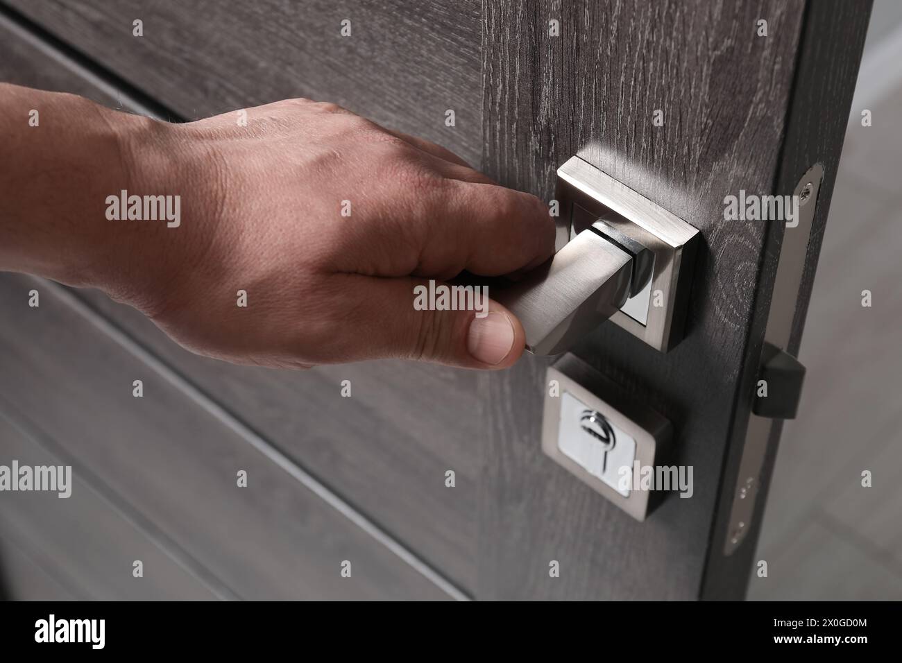 Home man closing door hi-res stock photography and images - Alamy