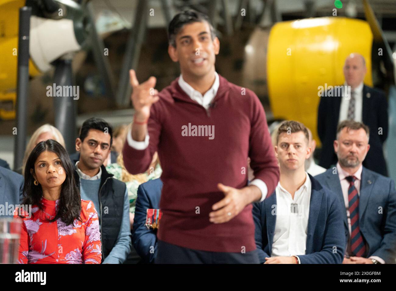 Akshata Murty, the wife of Prime Minister Rishi Sunak, watches as he speaks during a Q&A event at the RAF Museum in Hendon, north west London, as he launches an employment plan which pledges to help veterans secure high-paid jobs after they leave the armed forces. Picture date: Friday April 12, 2024. Stock Photo