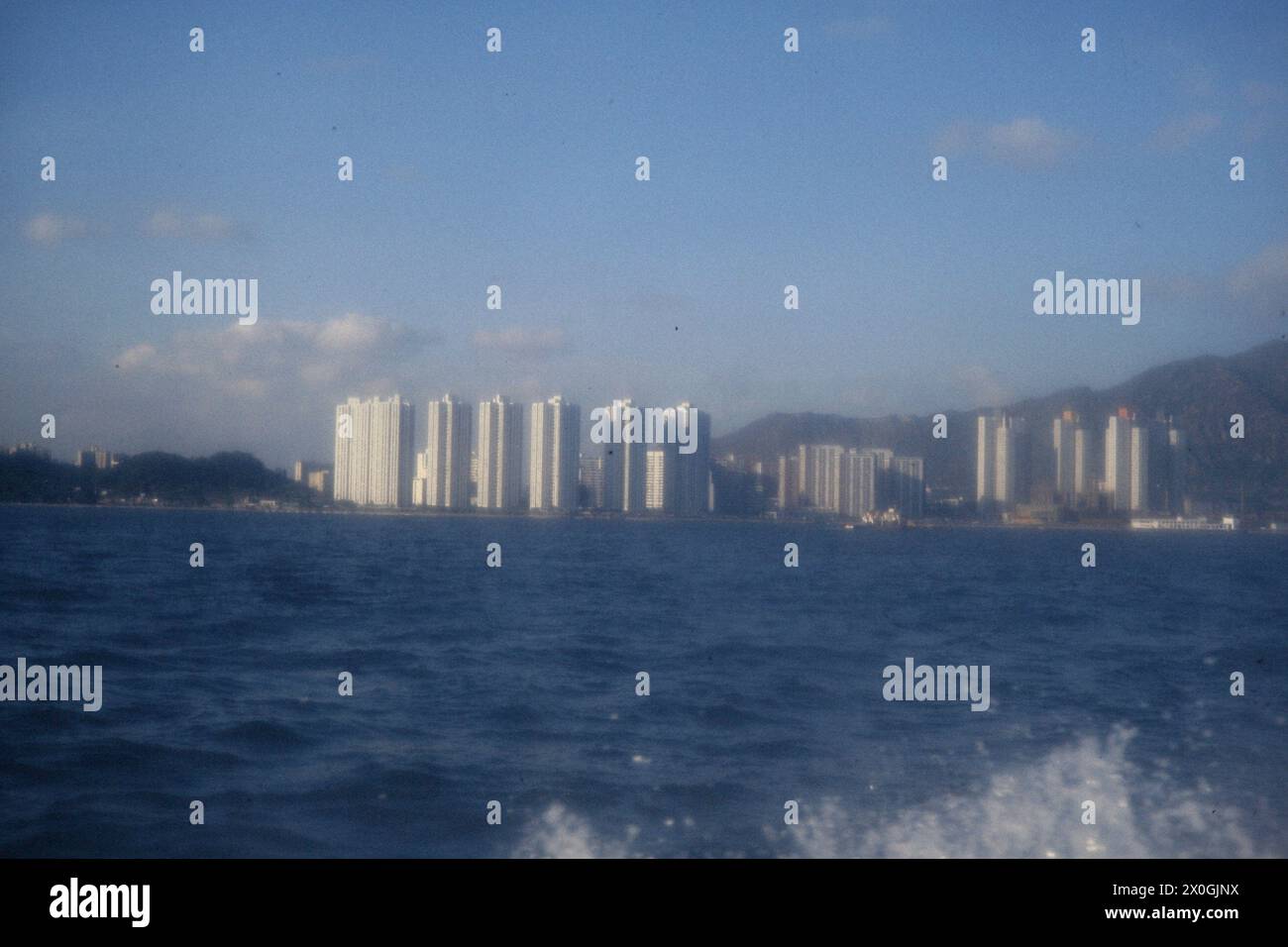 White high-rise buildings of a suburb of Hong Kong. [automated ...