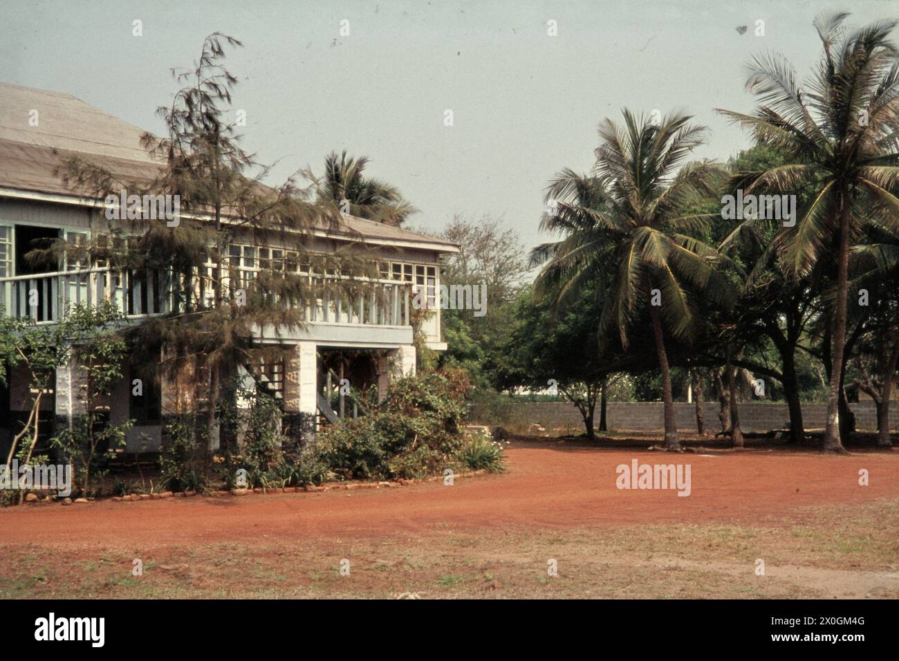 An old English mansion in Accra, surrounded by a wall. [automated translation] Stock Photo