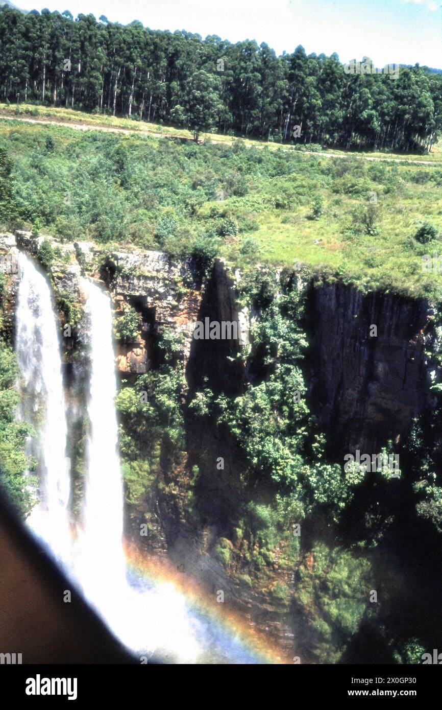 A rainbow over the Mac Mac waterfalls in Mpumalanga. [automated ...