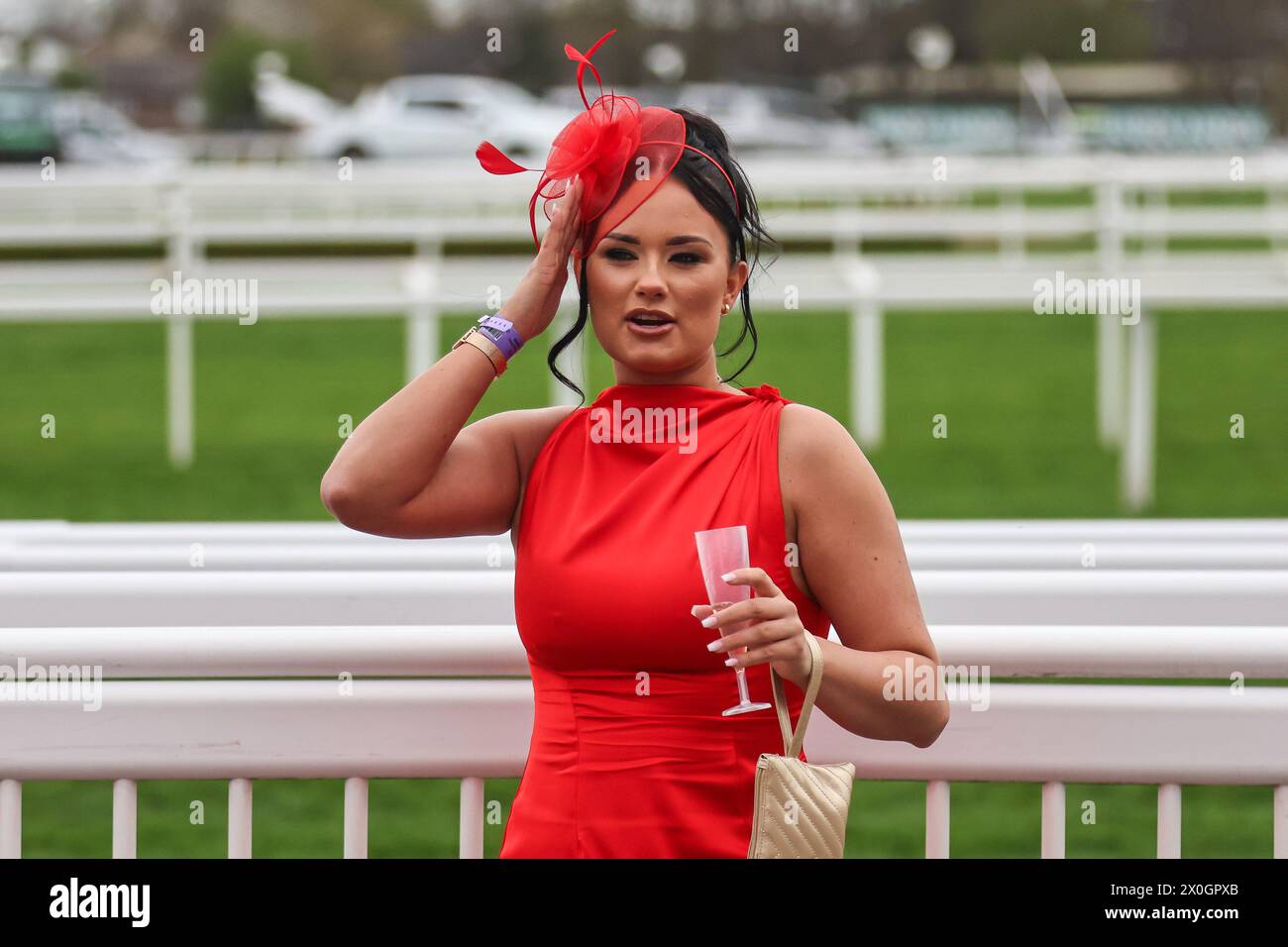 A Racegoer during the The Randox Grand National 2024 Ladies Day at