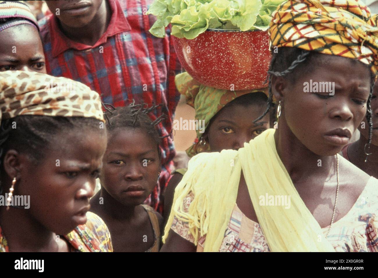 Dendi women and girls at a market square in Kandi. Stock Photo