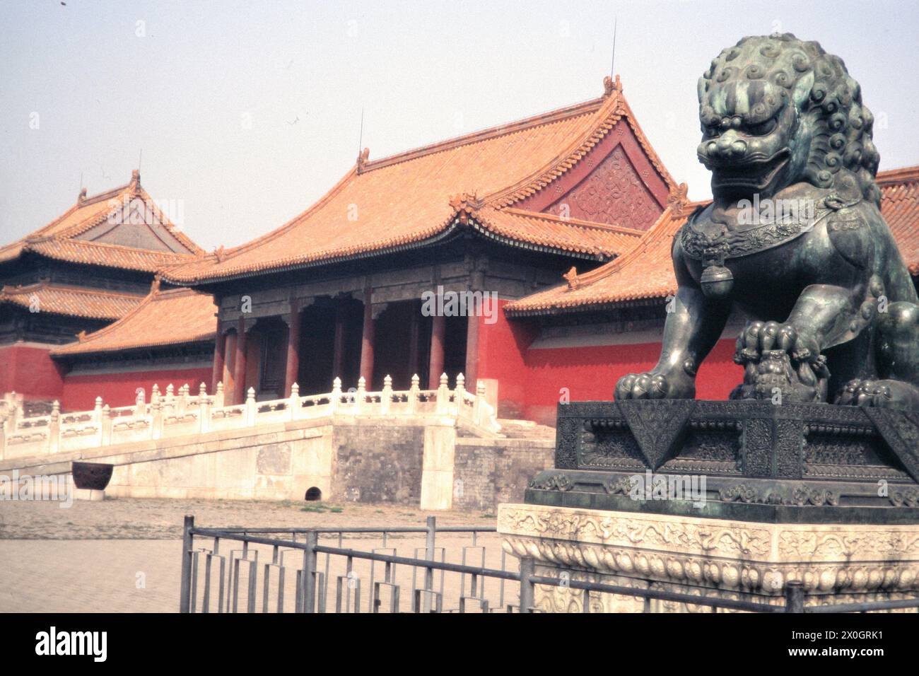The sculpture of a mythical creature in front of the Taihe Men Palace ...