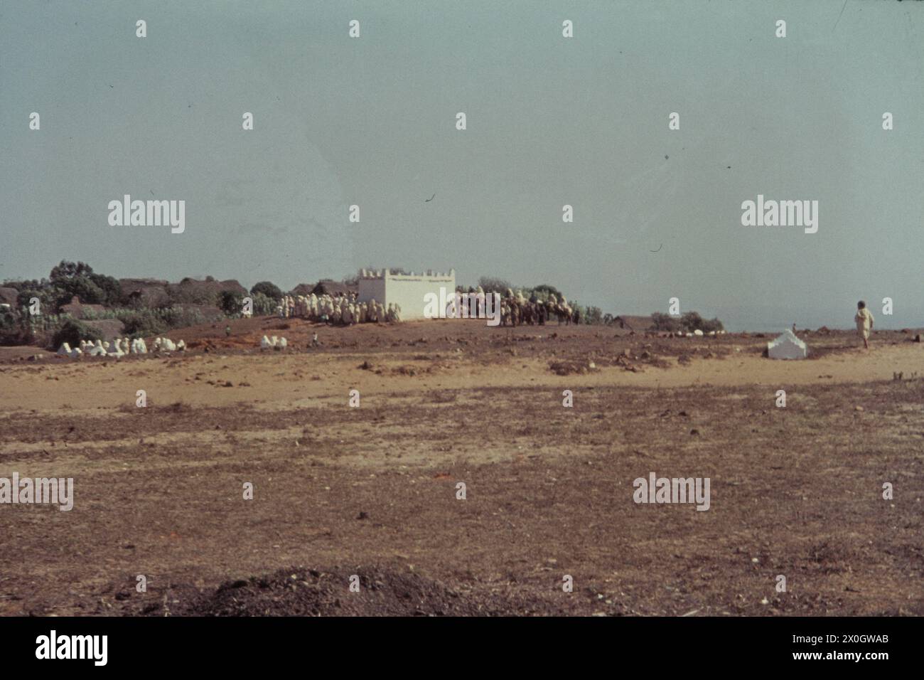 A crowd at a Moroccan cemetery during the funeral of a priest in Jemis