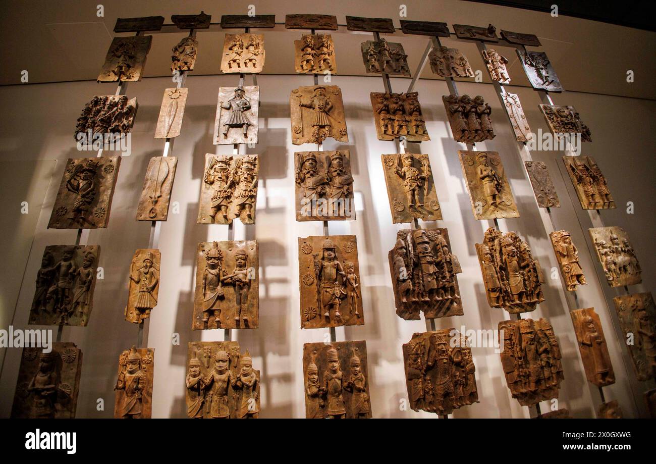 London, UK 12 April 2024 The Benin Bronzes in the Africa section at the British Museum. The Benin Bronzes are a group of thousands of objects including Cast Plaques, human and animal heads and figures that were taken from the kingdom of Benin, in what is now Nigeria, in 1897. The Bronzes were probably made between 1550-1650 by craftspeople working for the court of Oba the King. For many Nigerians, the Benin Bronzes are a potent reminder of colonialism and its continued effects on African society. Citizens in the country have long called for the return of the Benin Bronzes. Stock Photo