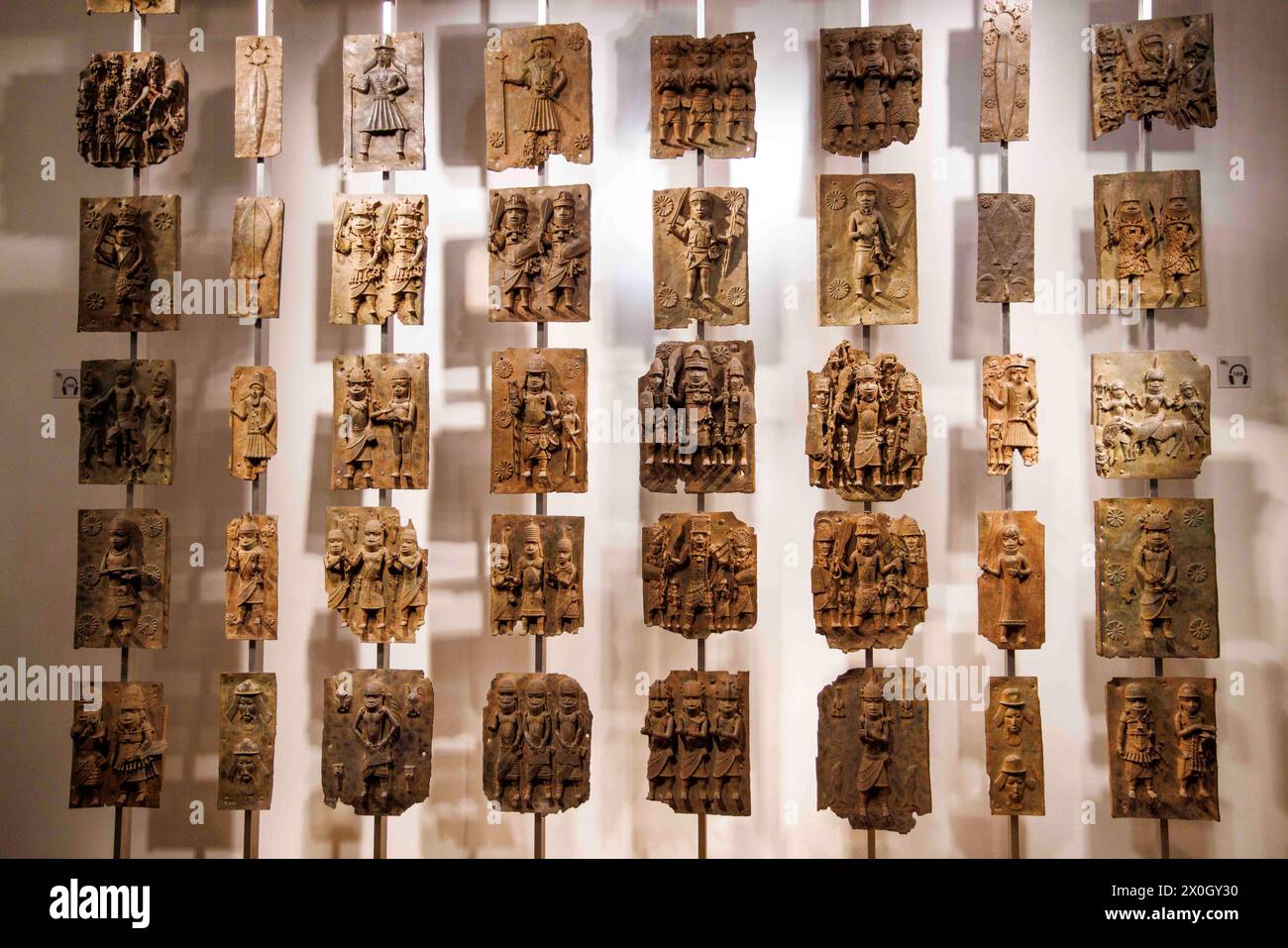 London, UK 12 April 2024 The Benin Bronzes in the Africa section at the British Museum. The Benin Bronzes are a group of thousands of objects including Cast Plaques, human and animal heads and figures that were taken from the kingdom of Benin, in what is now Nigeria, in 1897. The Bronzes were probably made between 1550-1650 by craftspeople working for the court of Oba the King. For many Nigerians, the Benin Bronzes are a potent reminder of colonialism and its continued effects on African society. Citizens in the country have long called for the return of the Benin Bronzes. Stock Photo