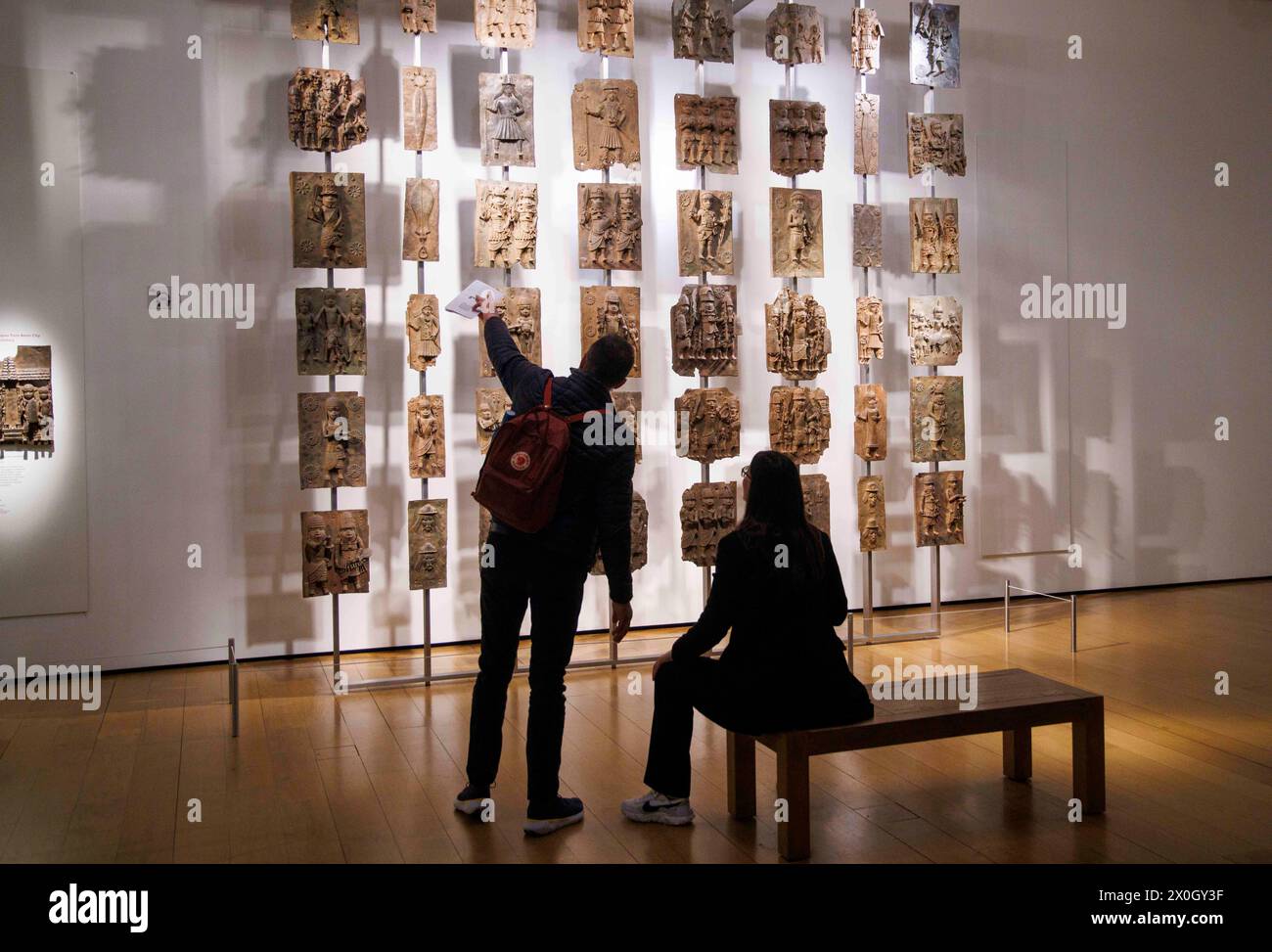 London, UK 12 April 2024 The Benin Bronzes in the Africa section at the British Museum. The Benin Bronzes are a group of thousands of objects including Cast Plaques, human and animal heads and figures that were taken from the kingdom of Benin, in what is now Nigeria, in 1897. The Bronzes were probably made between 1550-1650 by craftspeople working for the court of Oba the King. For many Nigerians, the Benin Bronzes are a potent reminder of colonialism and its continued effects on African society. Citizens in the country have long called for the return of the Benin Bronzes. Stock Photo