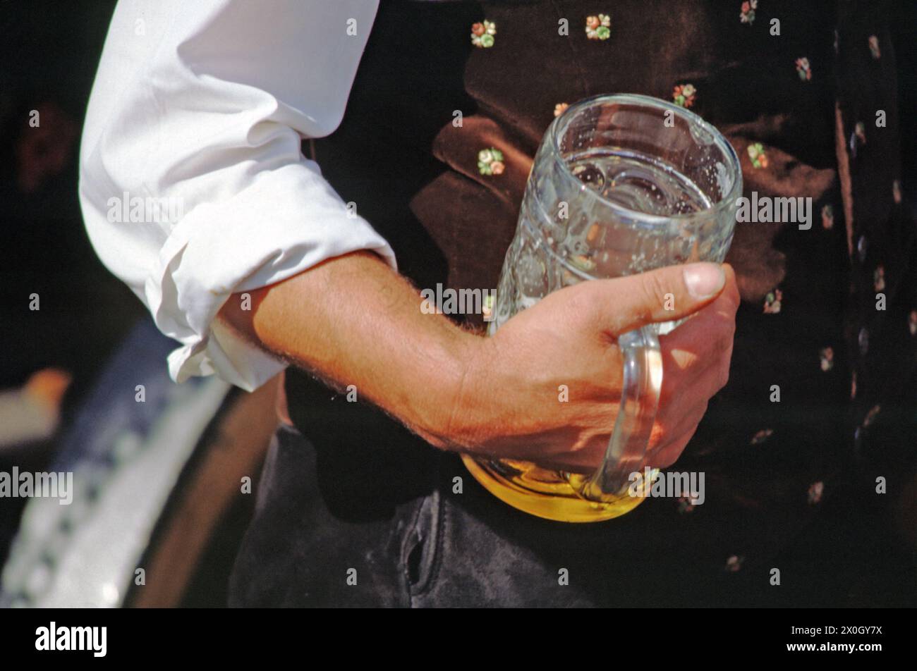 Beer coachman with masses of beer at the Oktoberfest in Munich. [automated translation] Stock Photo