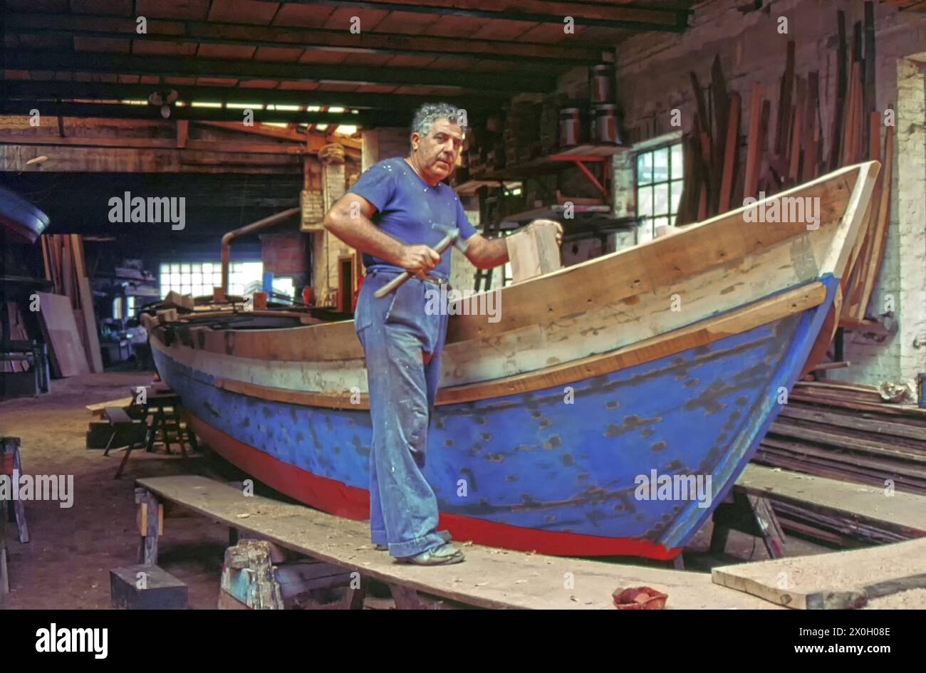 A boat builder in his workshop in Burano, an island in the Venice lagoon [automated translation] Stock Photo