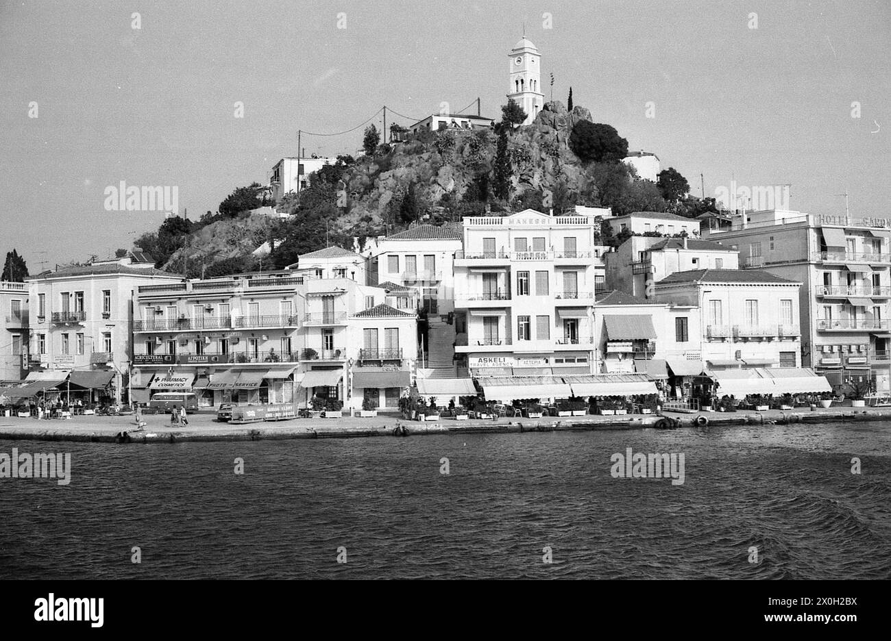 Old town and clock tower on the island of Poros in the Saronic Gulf. Stock Photo