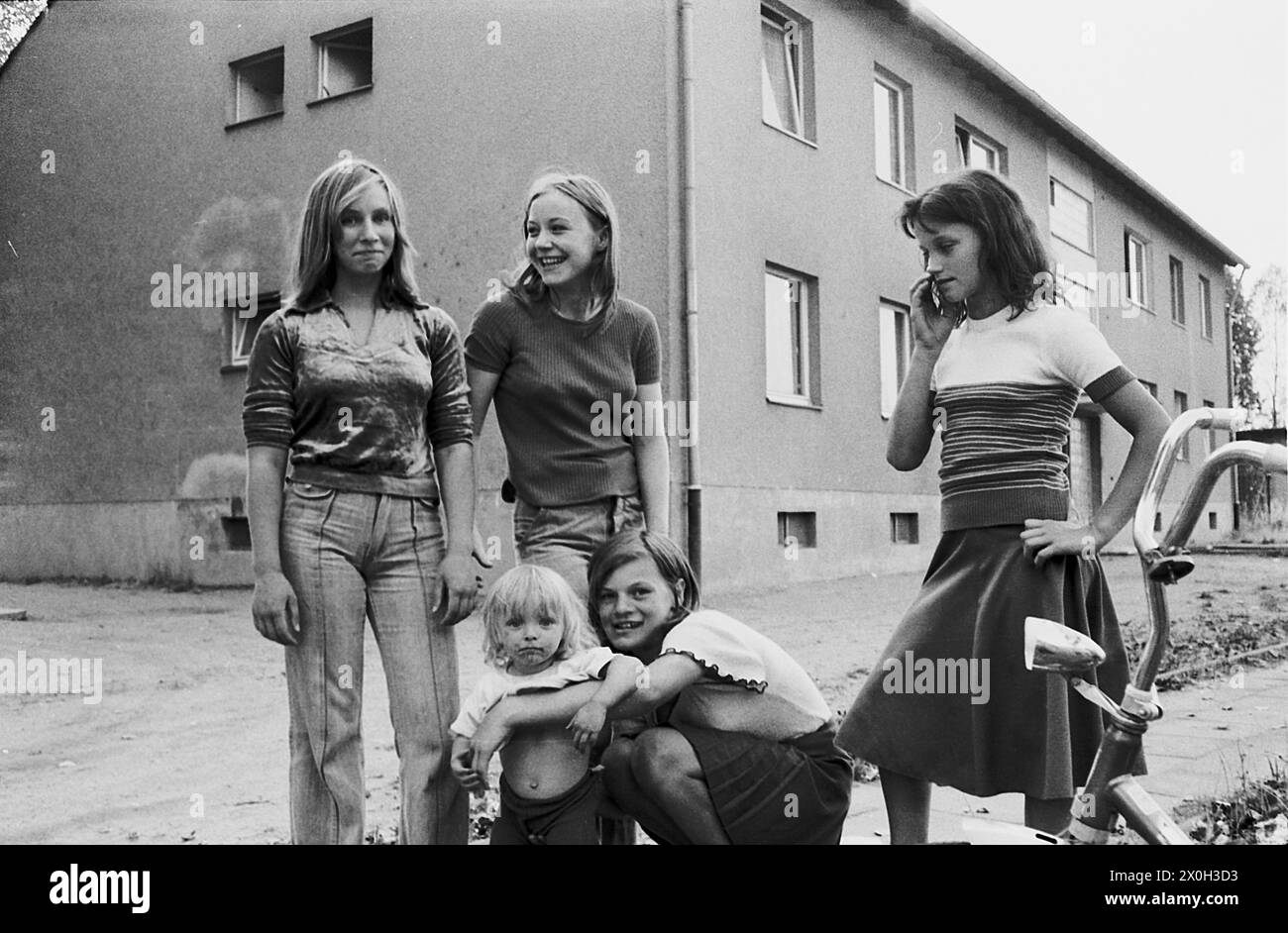 Children and young people in front of social housing [automated translation] Stock Photo