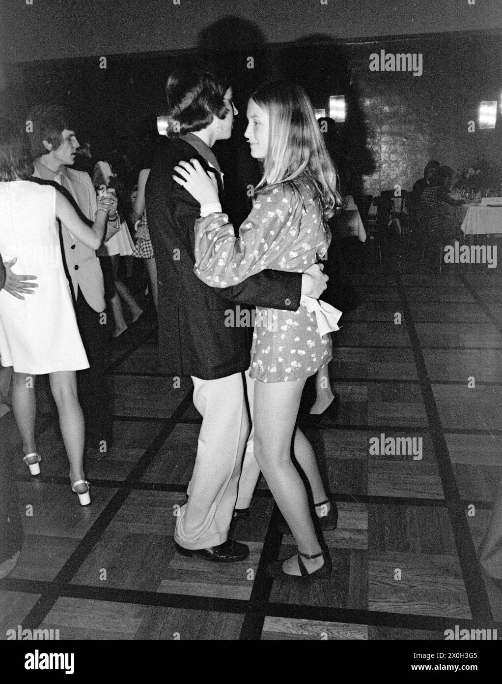 On a dance floor a young couple takes part in a dance short. [automated translation] Stock Photo