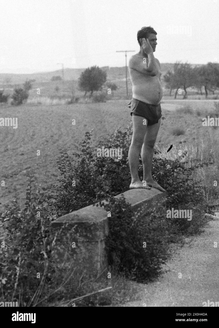 'Air drying after a ''refreshing bath'' in the irrigation channel. [automated translation]' Stock Photo