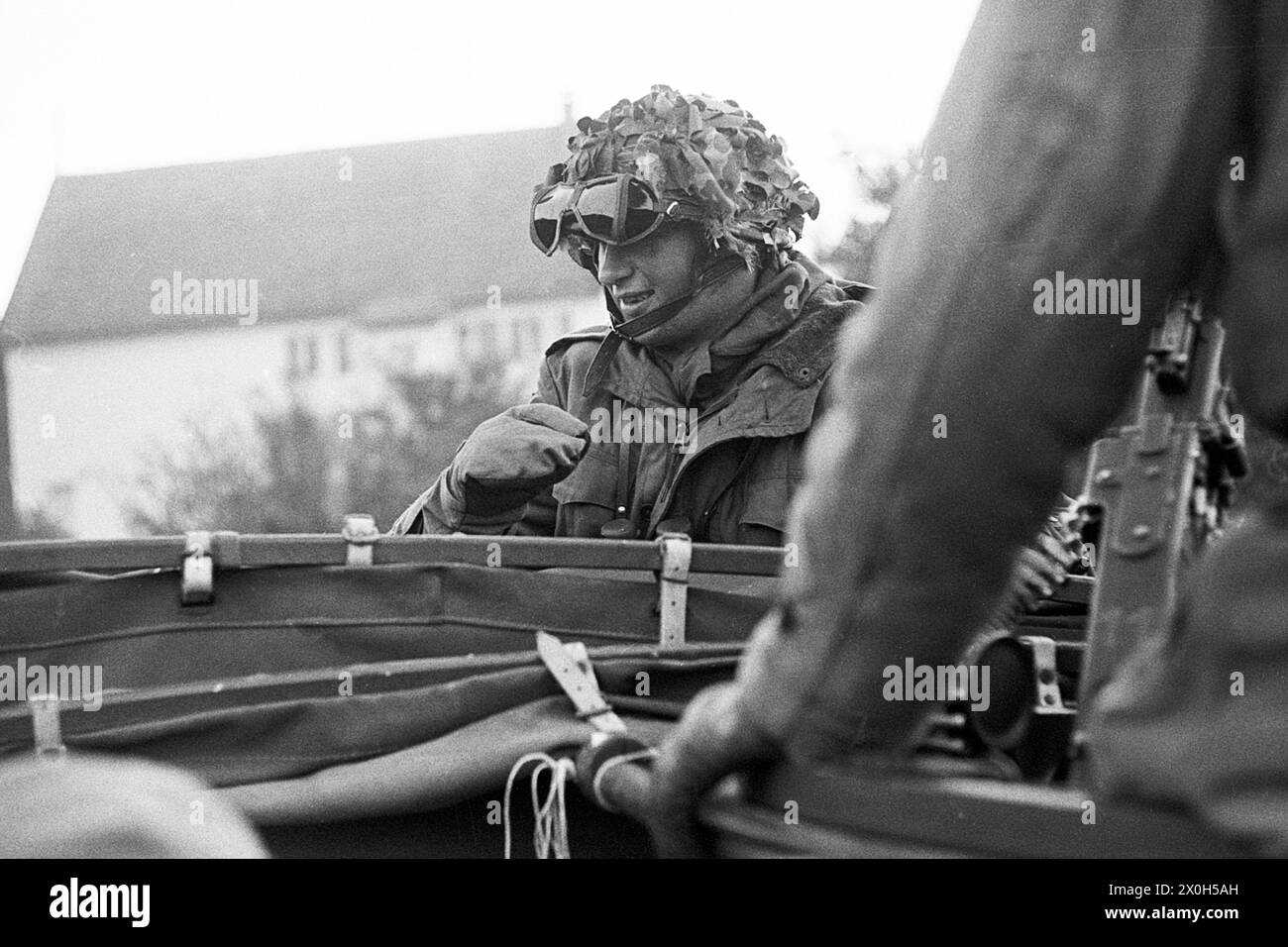 A non-commissioned officer of the German Armed Forces gives ...