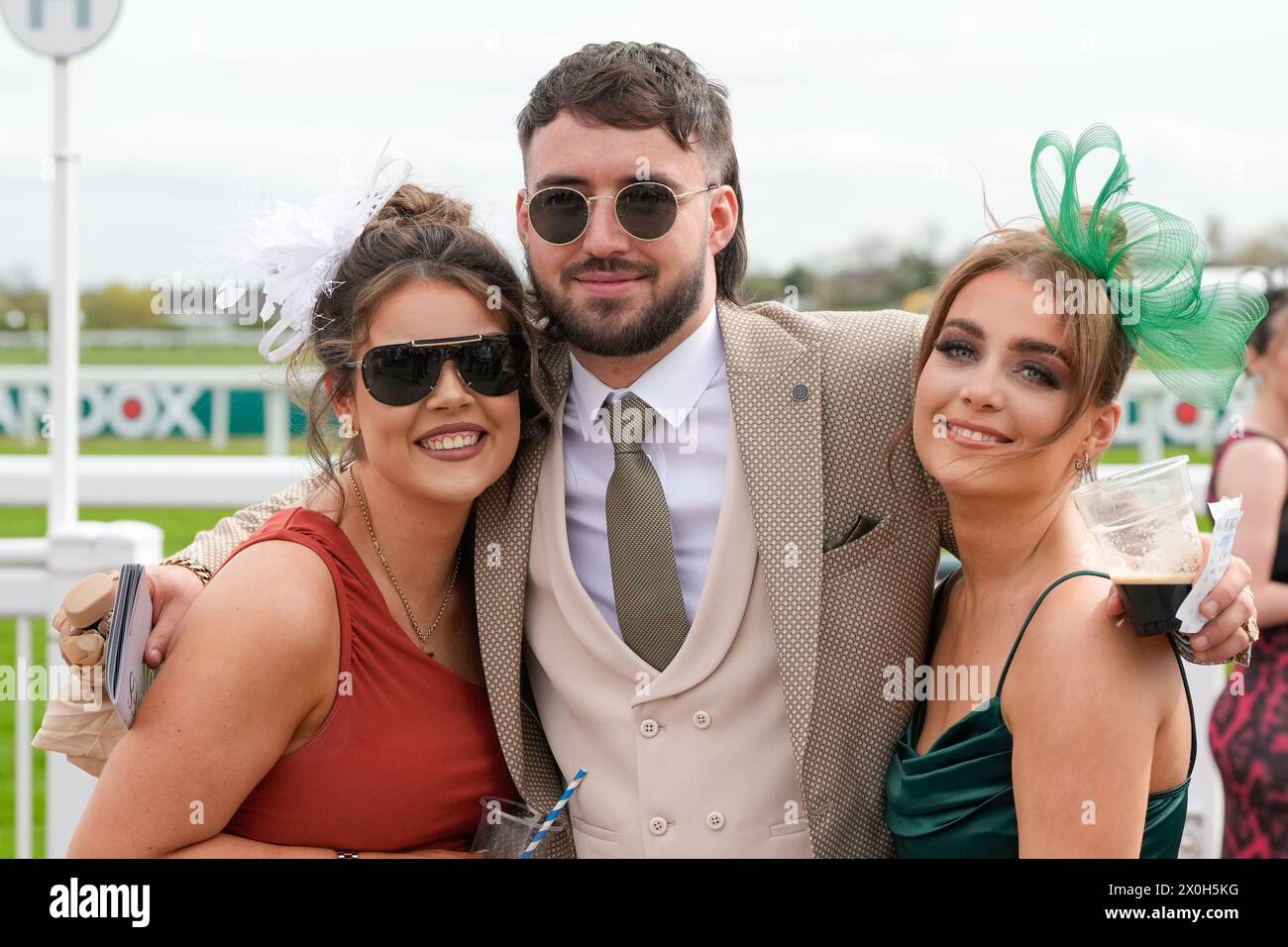 Aintree Racecourse, Aintree, Merseyside, England. 12th April 2024.  2024 Grand National Festival Day 2; Race goers pose for photos during Ladies Day, day 2 of the festival.Photo credit: Stephen Hearn/Action Plus Sports Images/ Alamy Live News Stock Photo