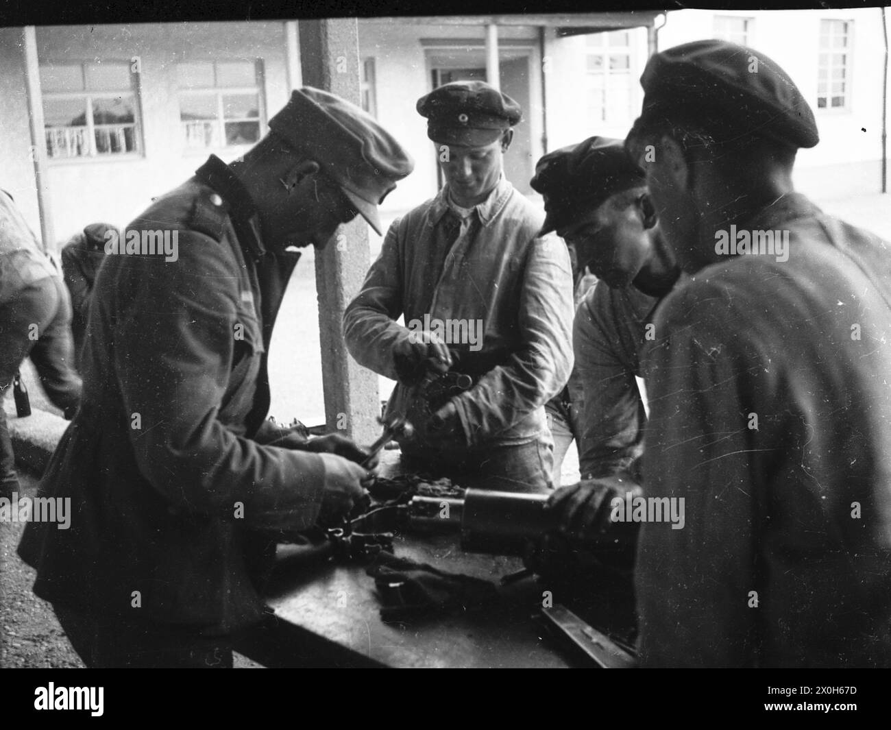 After firing, the machine gun is dismantled and cleaned by Wehrmacht ...