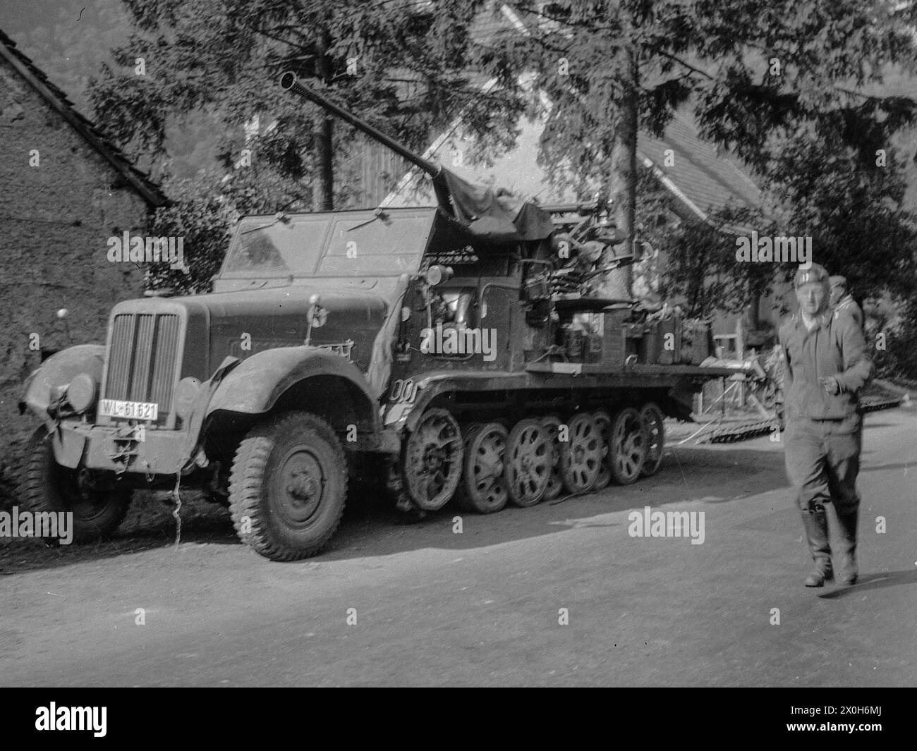 A Wehrmacht half-track vehicle with SD Kfz 11 with a 3.7cm anti-aircraft gun. The picture was taken by a member of the 154th Infantry Regiment / 58th Infantry Division, in France. [automated translation] Stock Photo